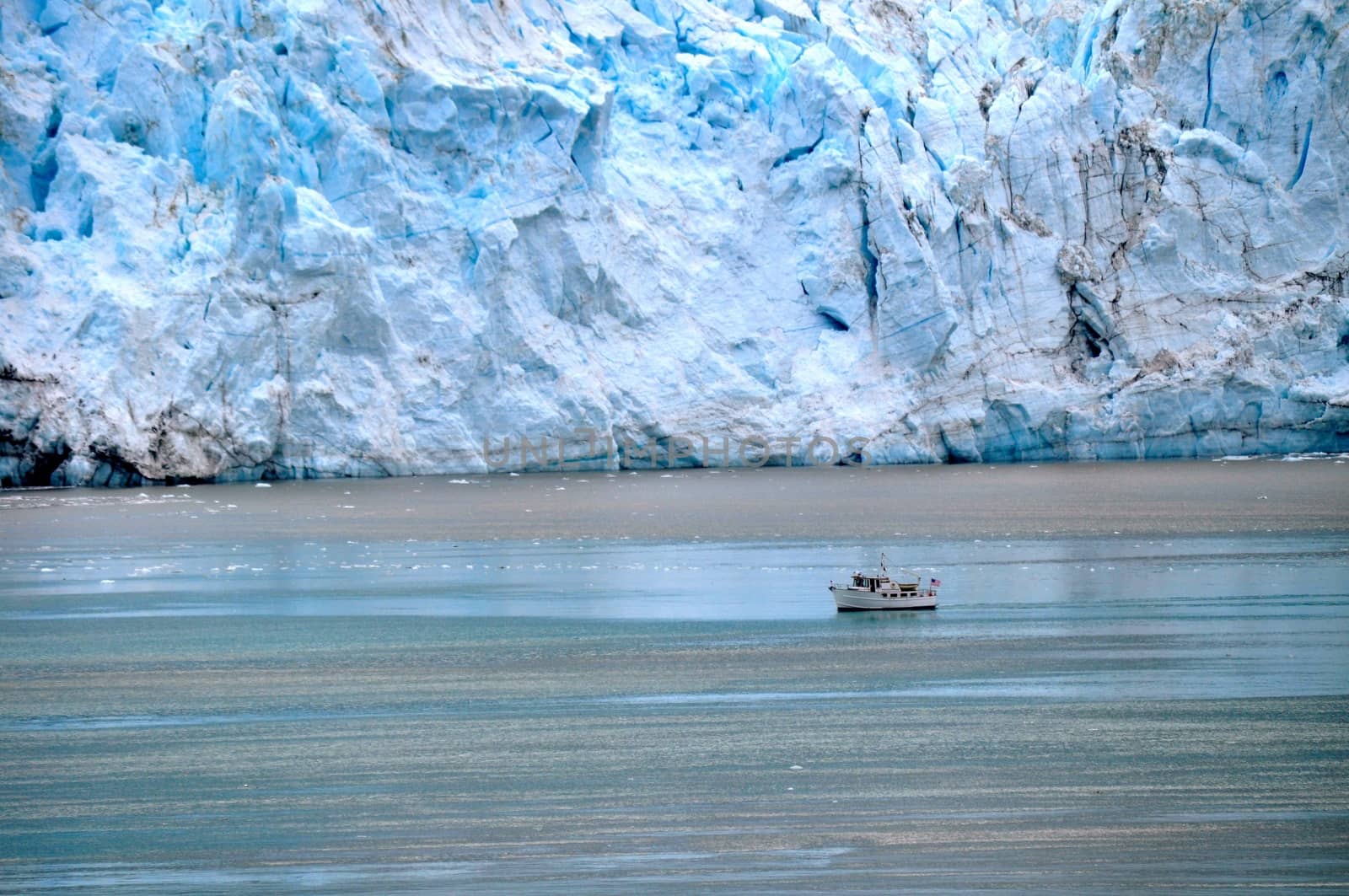 Boat beside glacier