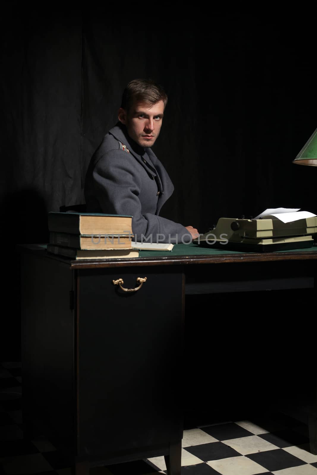 Russian military officer in a dark cabinet