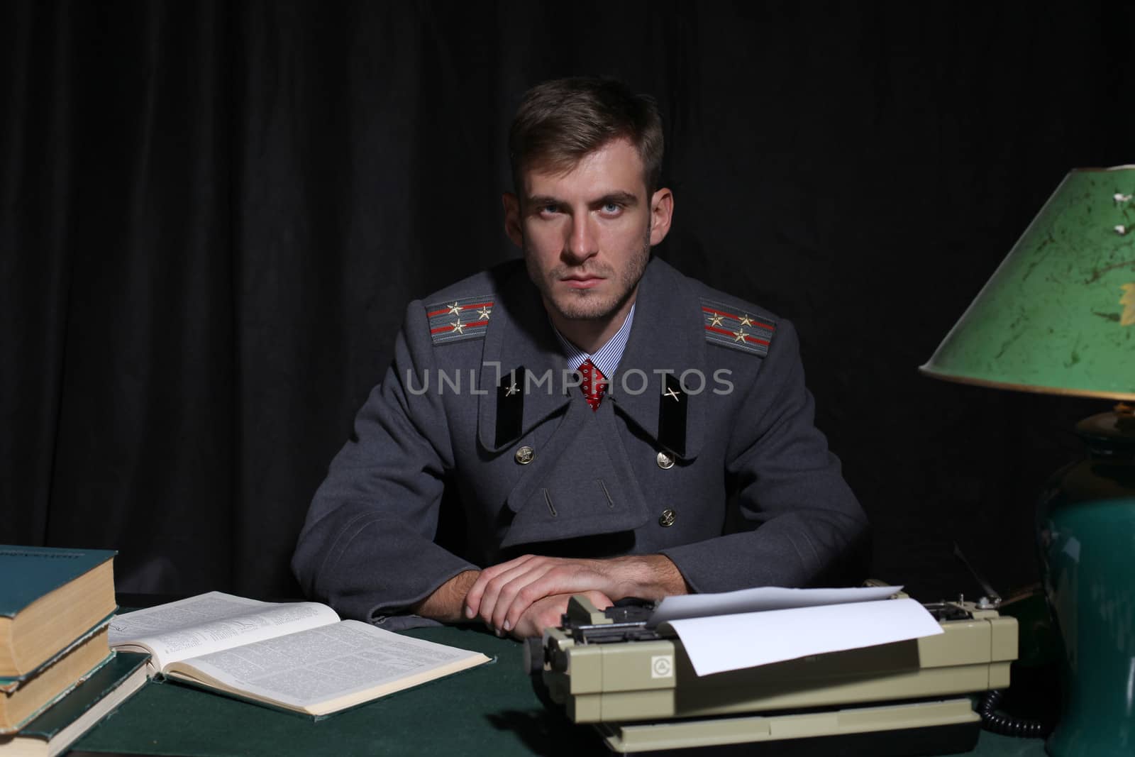Russian military officer in a dark cabinet