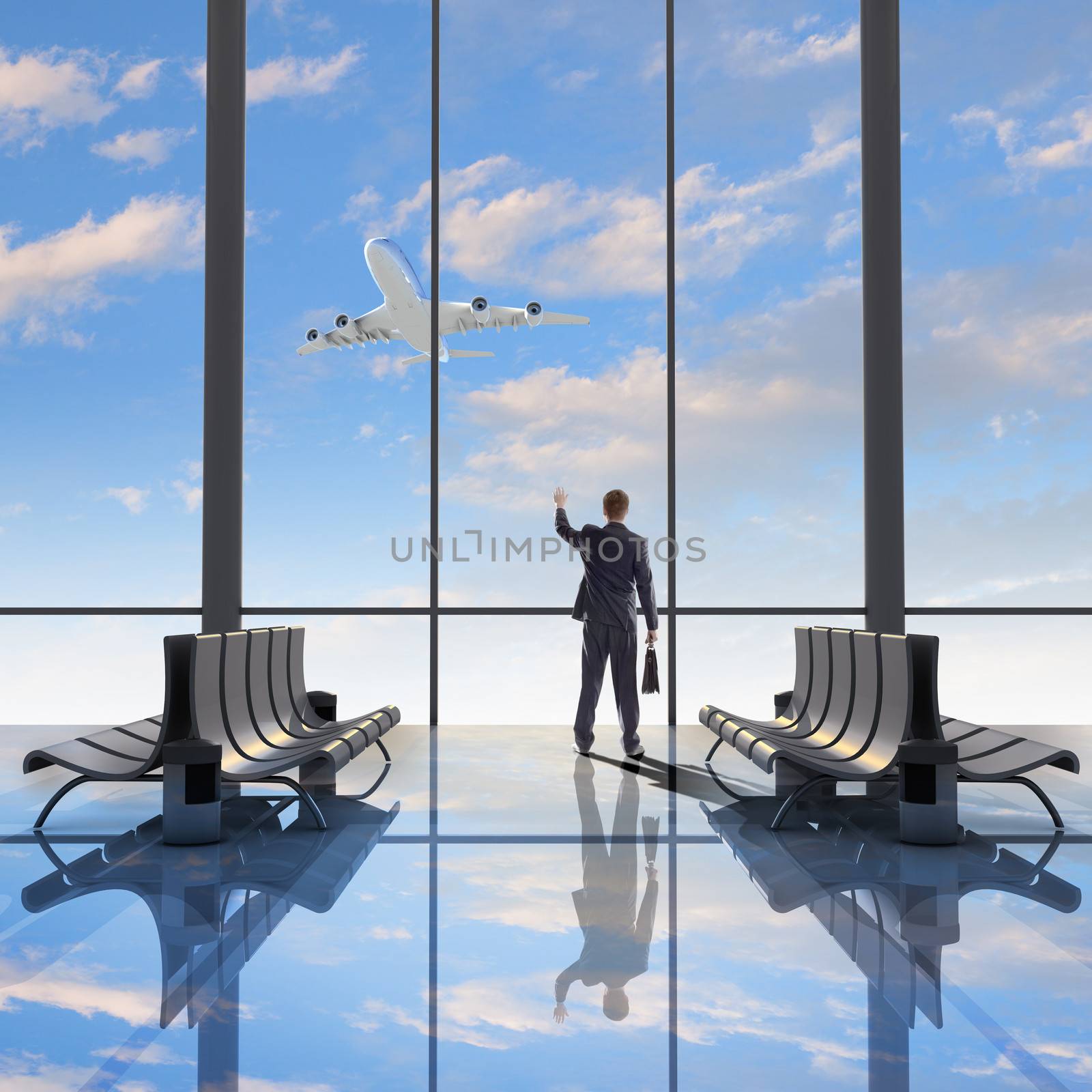 Businessman at airport looking at airplane taking off
