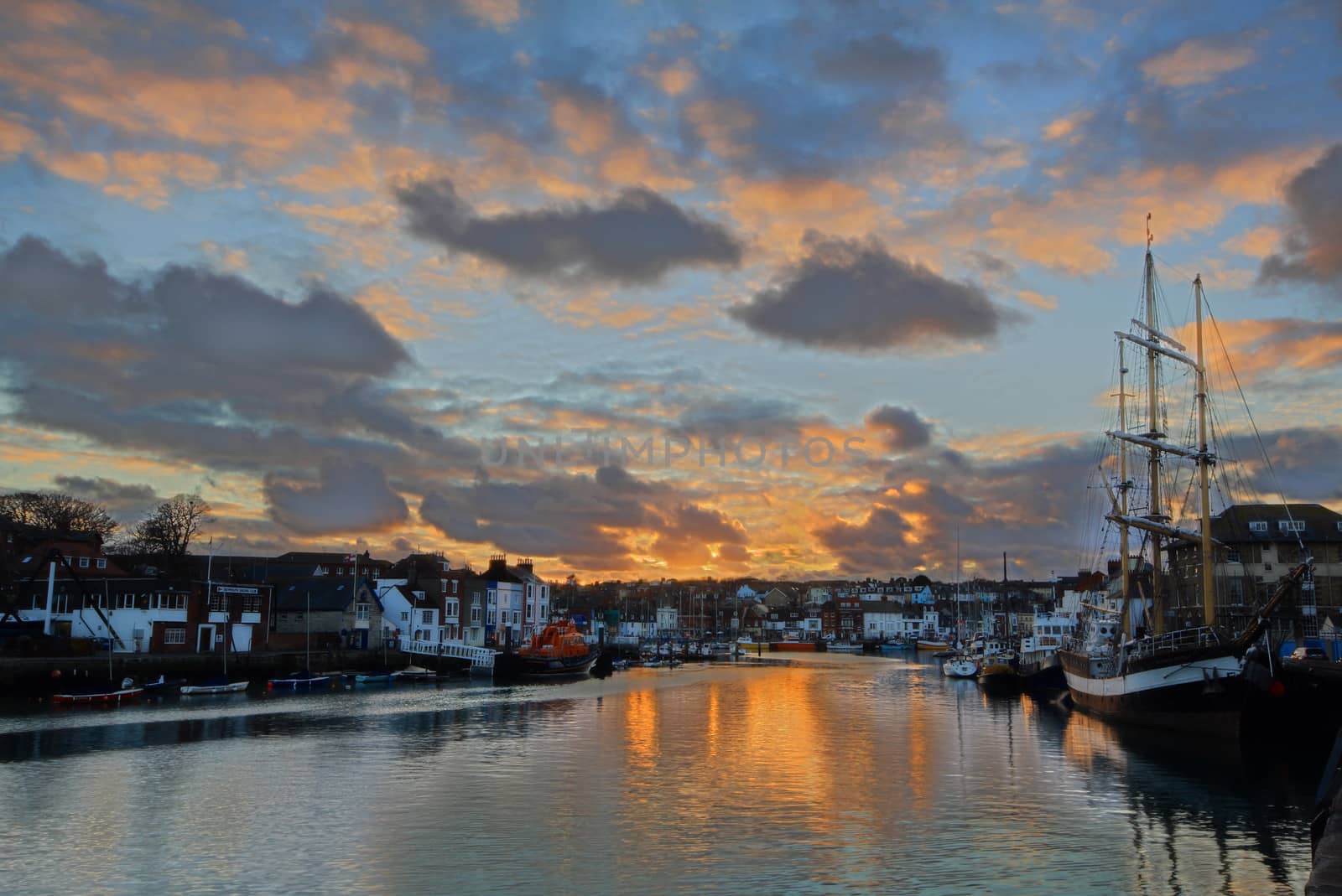 Weymouth harbour at sunset by olliemt
