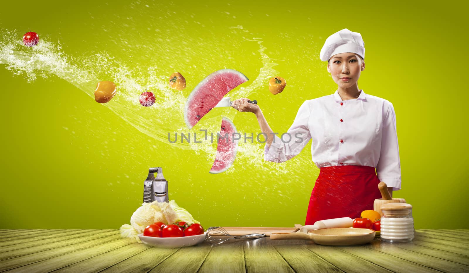Asian female cook with knife cutting fruits and vegetables in air