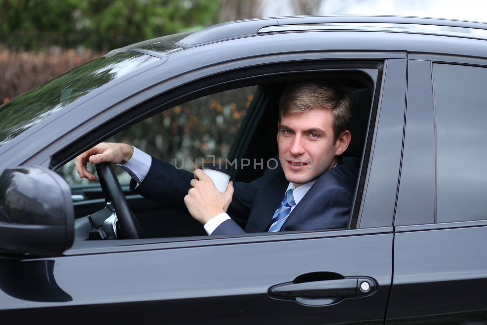 young attractive man young man in the car by andersonrise