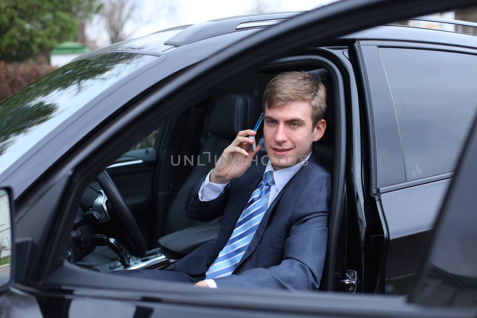 Portrait of young attractive man calling by phone