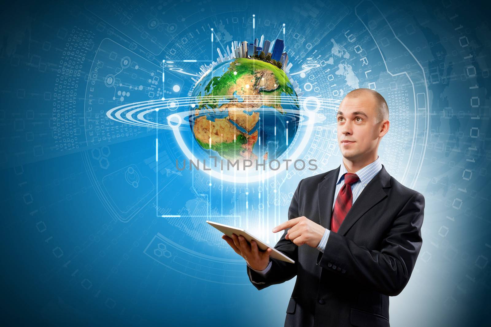 Image of businessman with tablet pc. Elements of this image are furnished by NASA