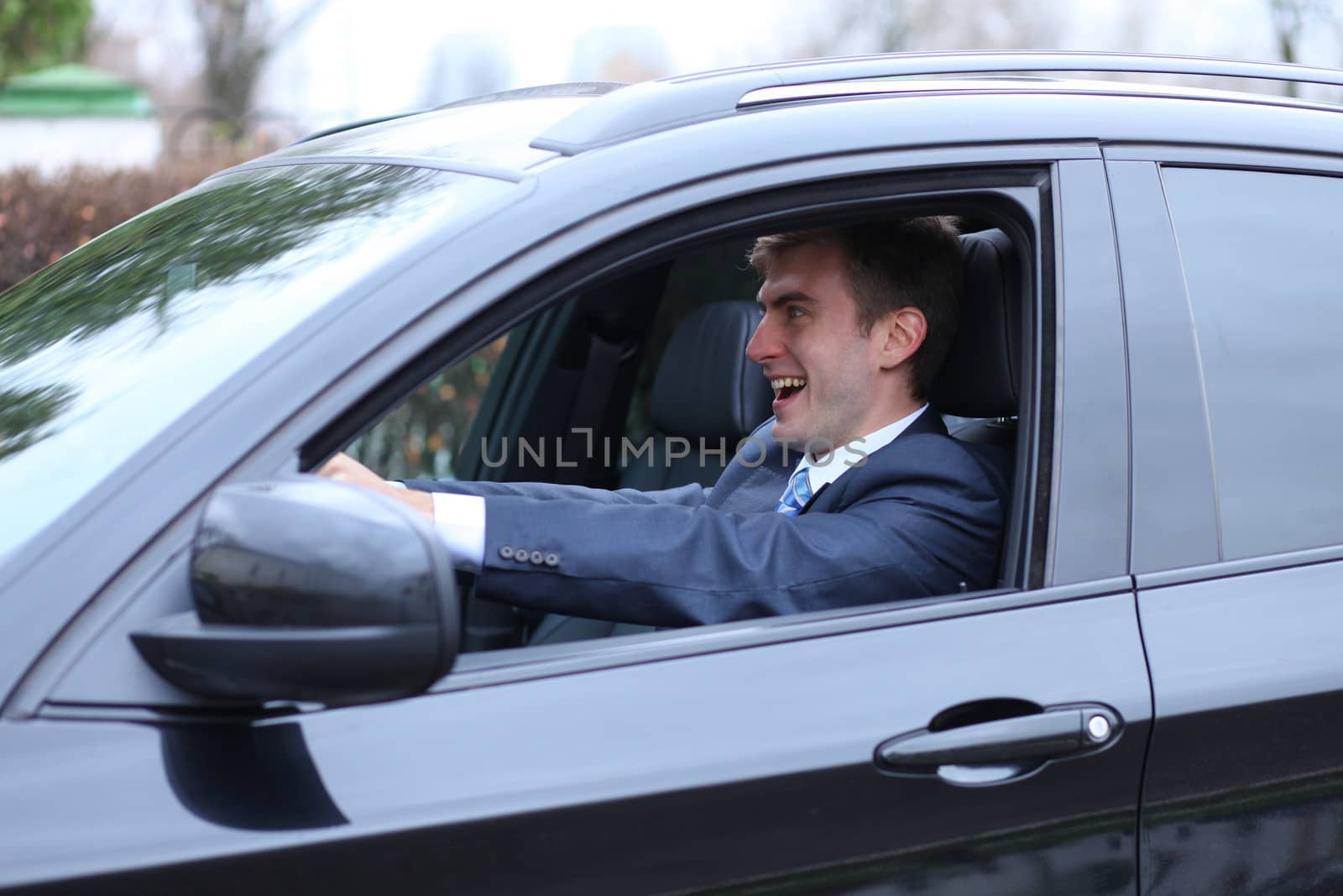 young attractive man young man in the car by andersonrise