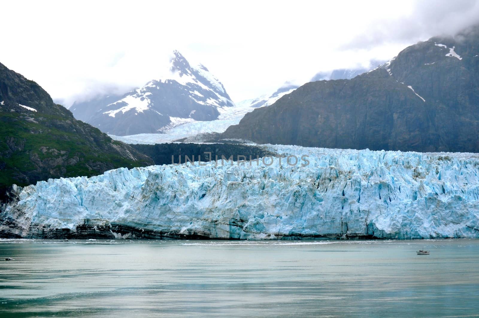 Alaskan Glacier and boat right by RefocusPhoto