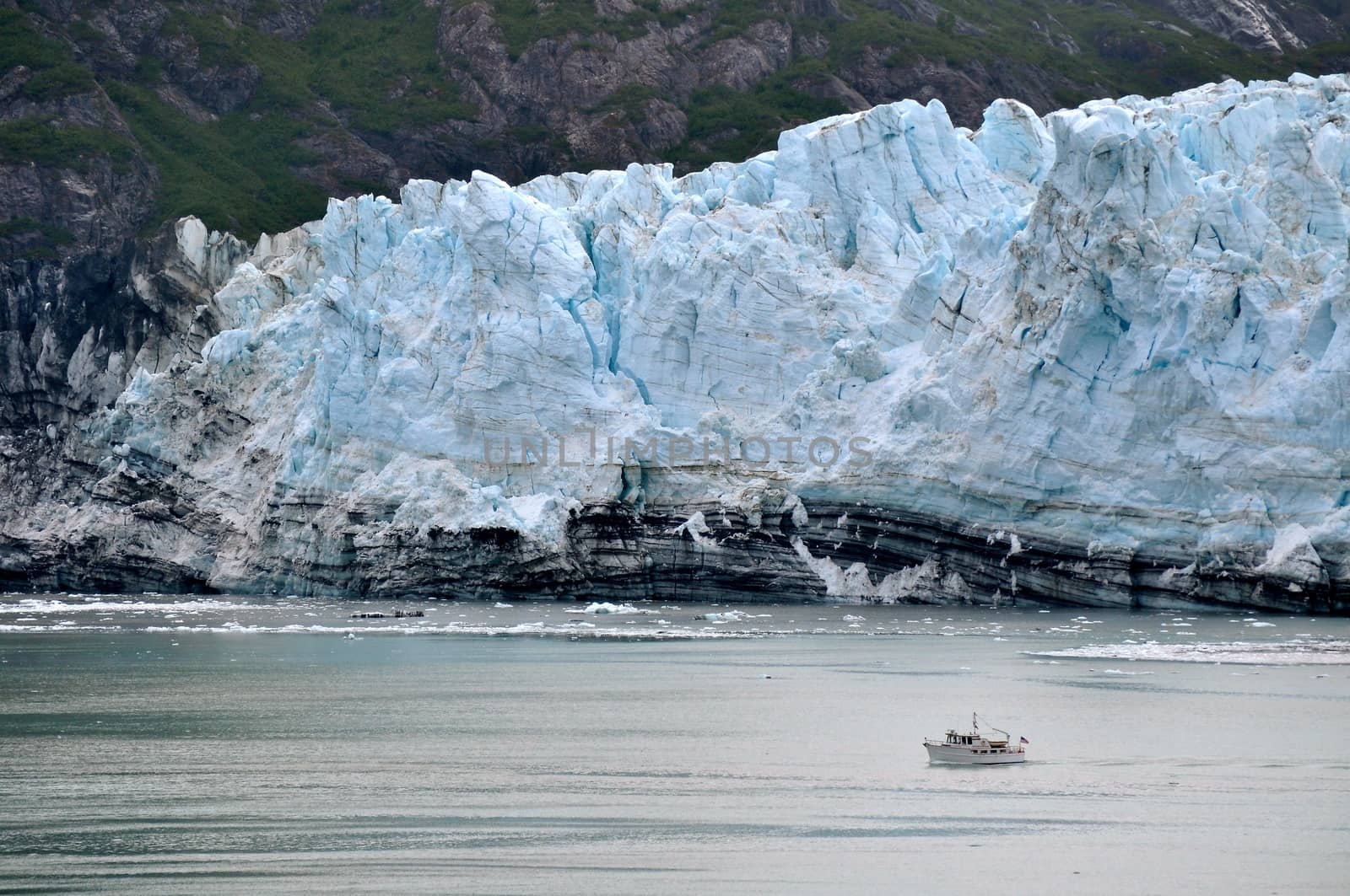 Boat glides past glaciers by RefocusPhoto