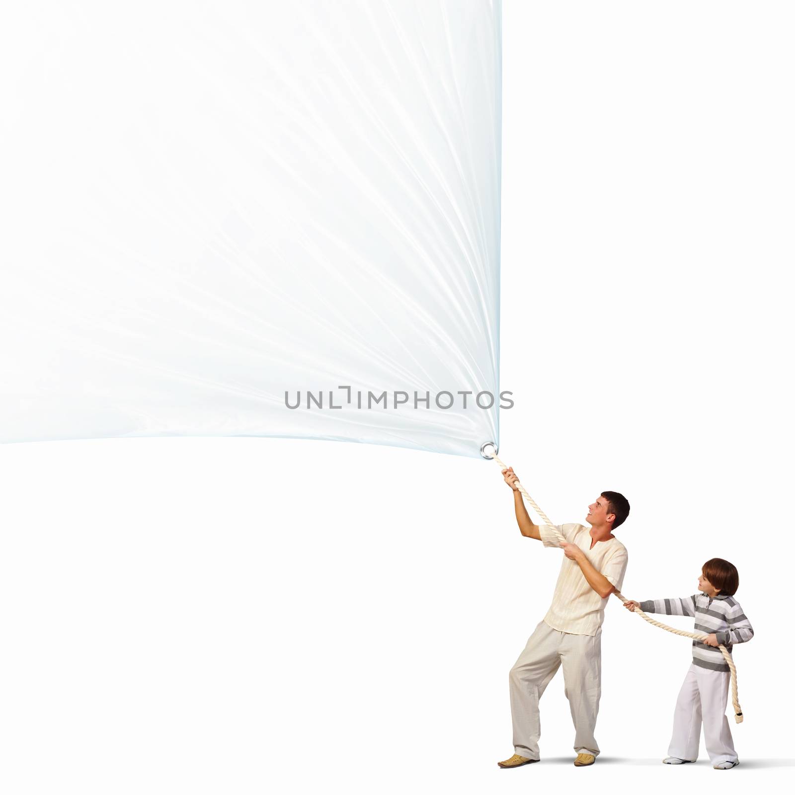 Young happy family pulling blank banner. Place for text