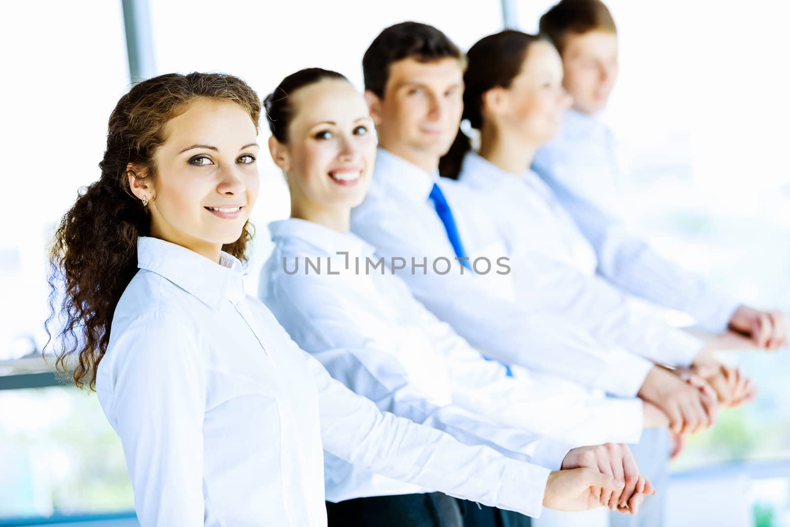 Image of young business people standing in line. Interaction concept