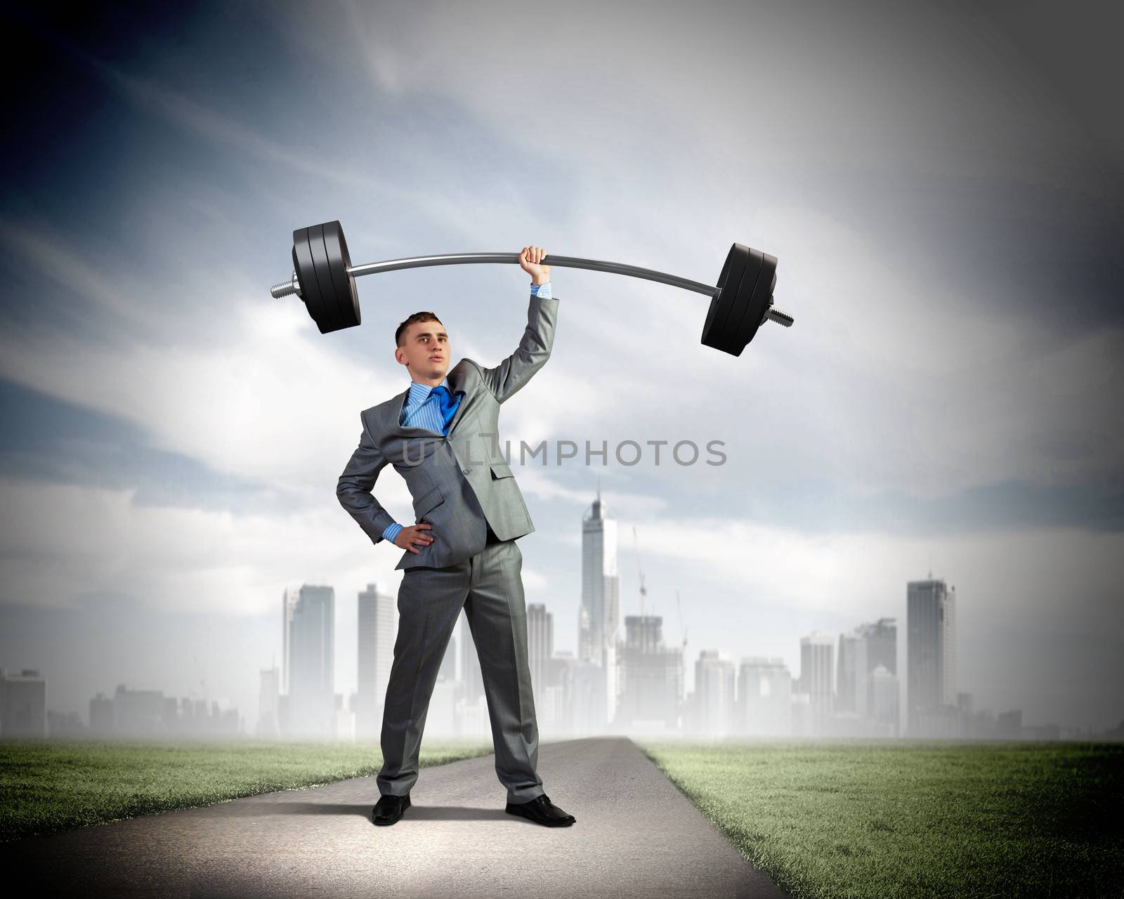 Image of strong businessman lifting barbell above head with one hand