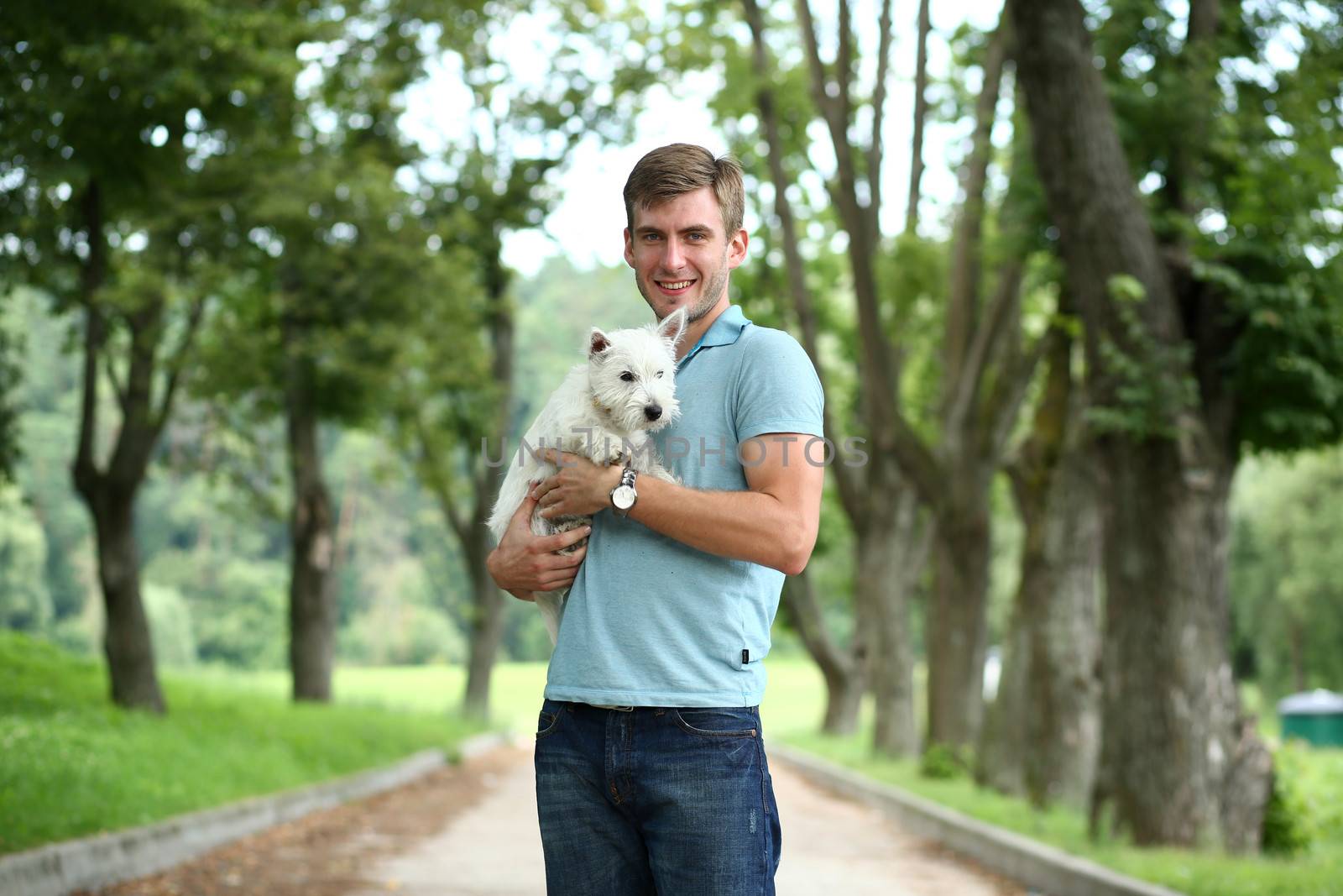 Young man and his adorable little dog