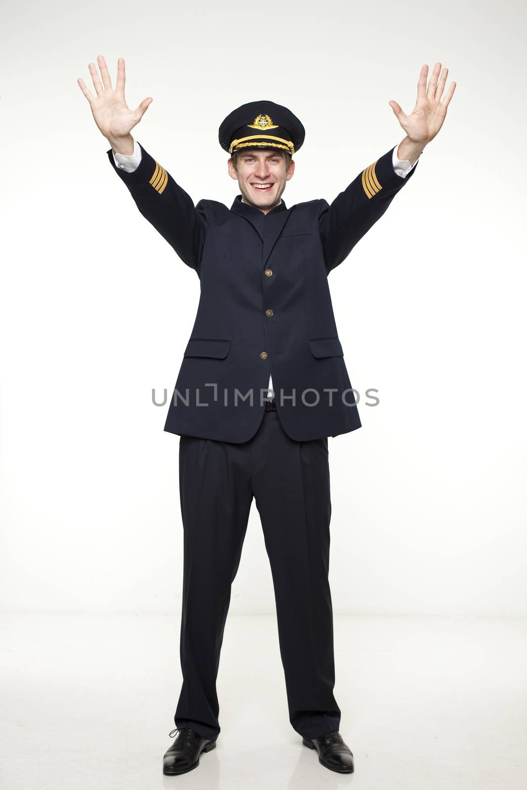 Portrait of a young man in the form of a passenger plane pilot