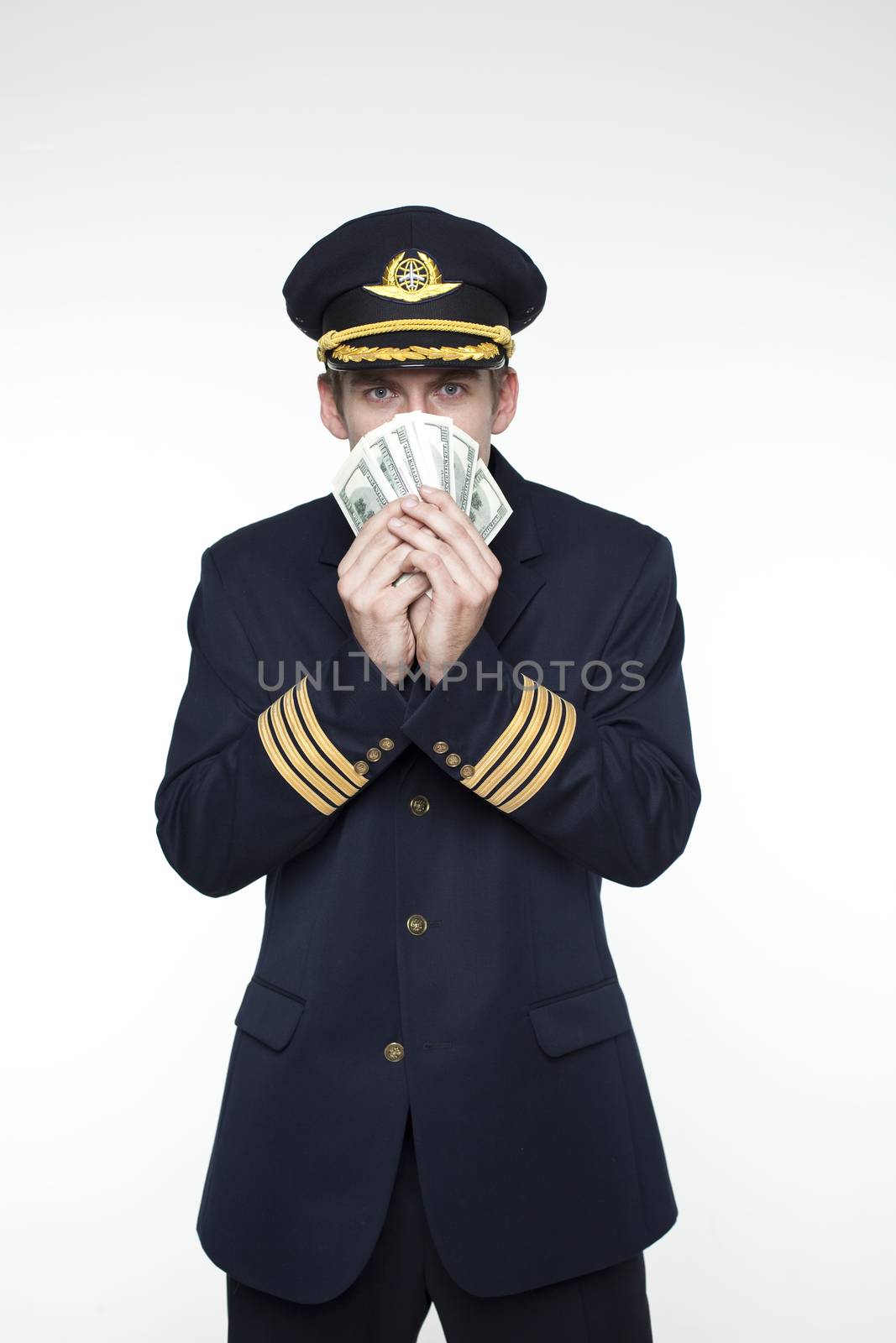 Portrait of a young man in the form of a passenger plane pilot