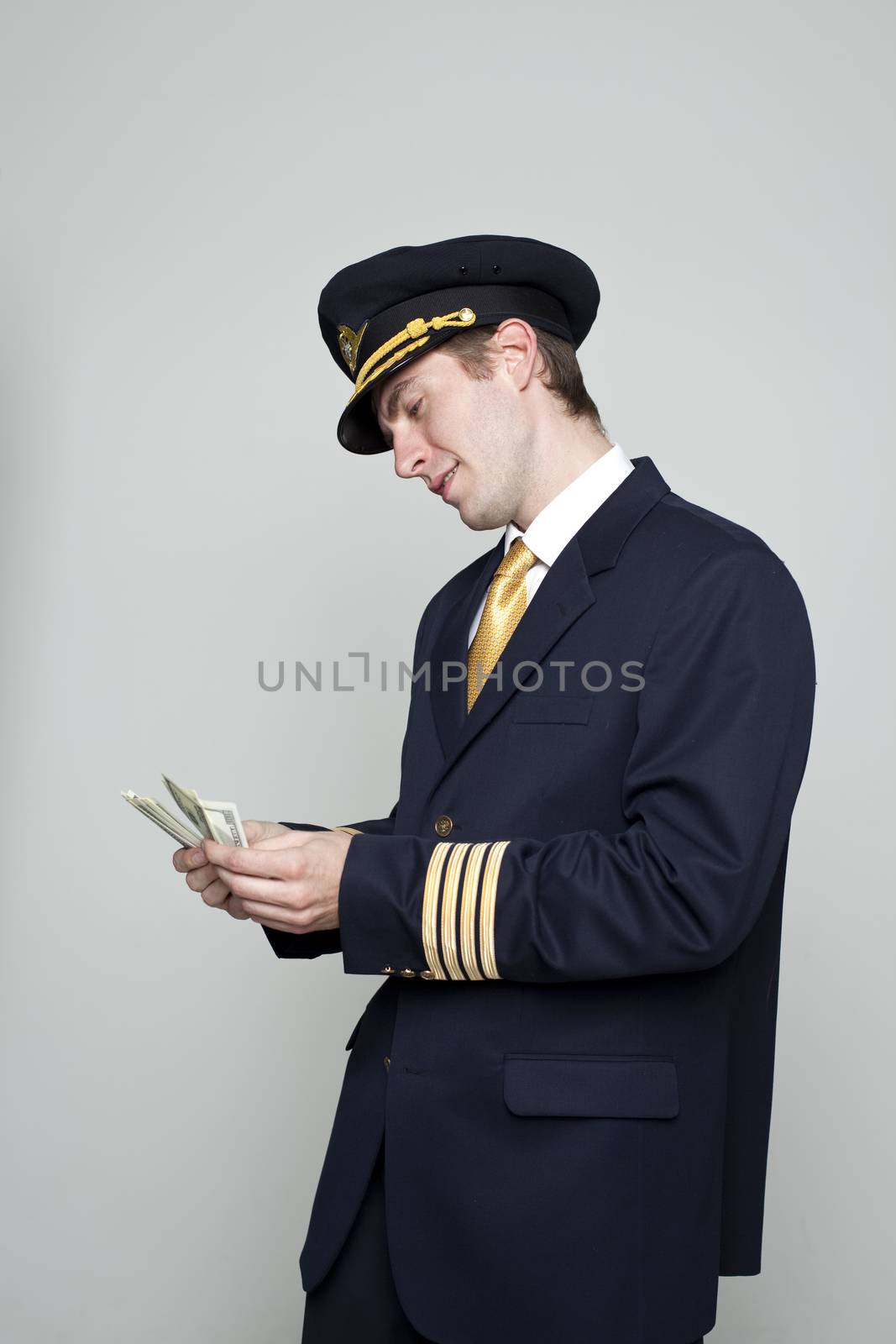 Young man in the form of a passenger plane pilot by andersonrise