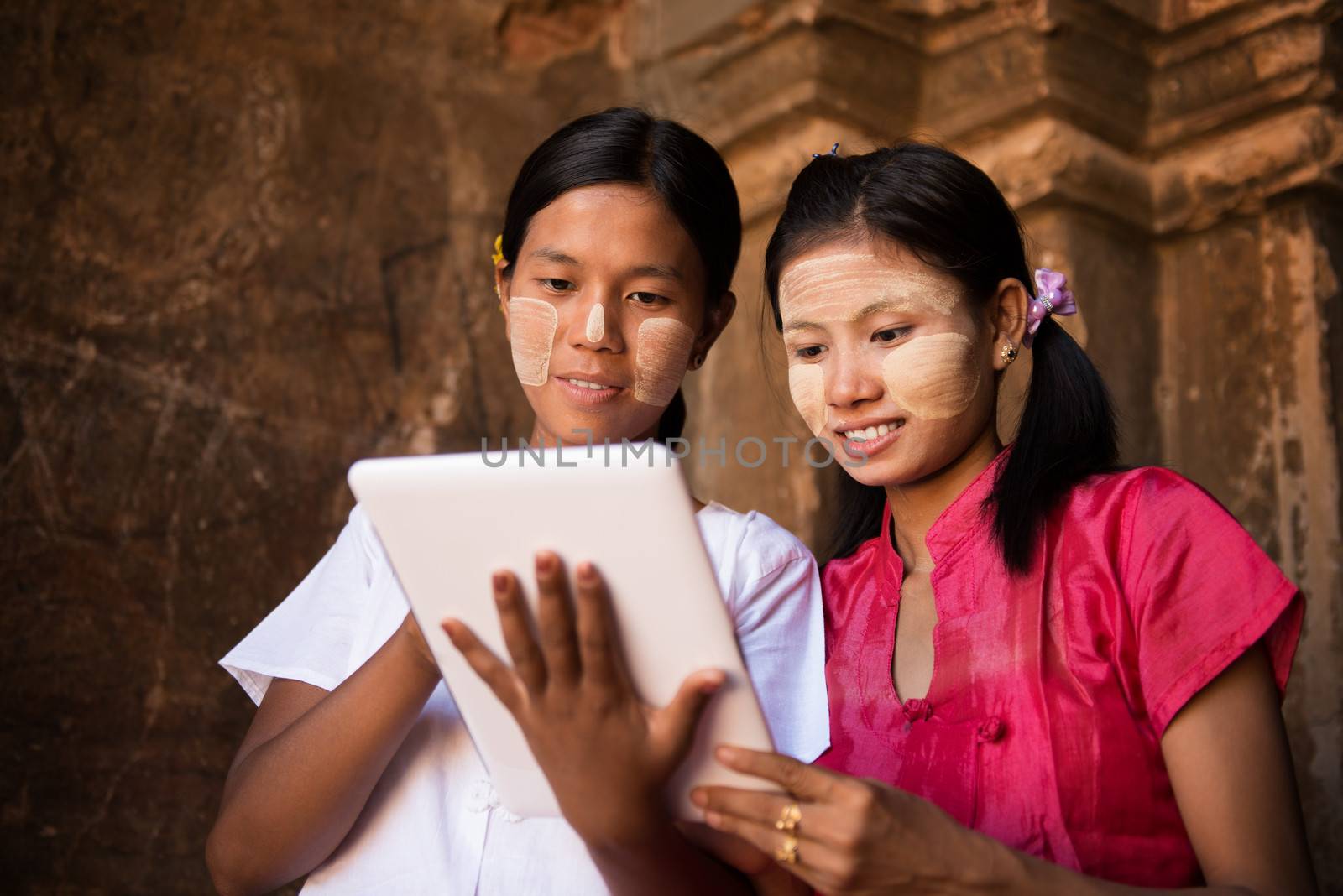 Myanmar girl using digital tablet pc  by szefei