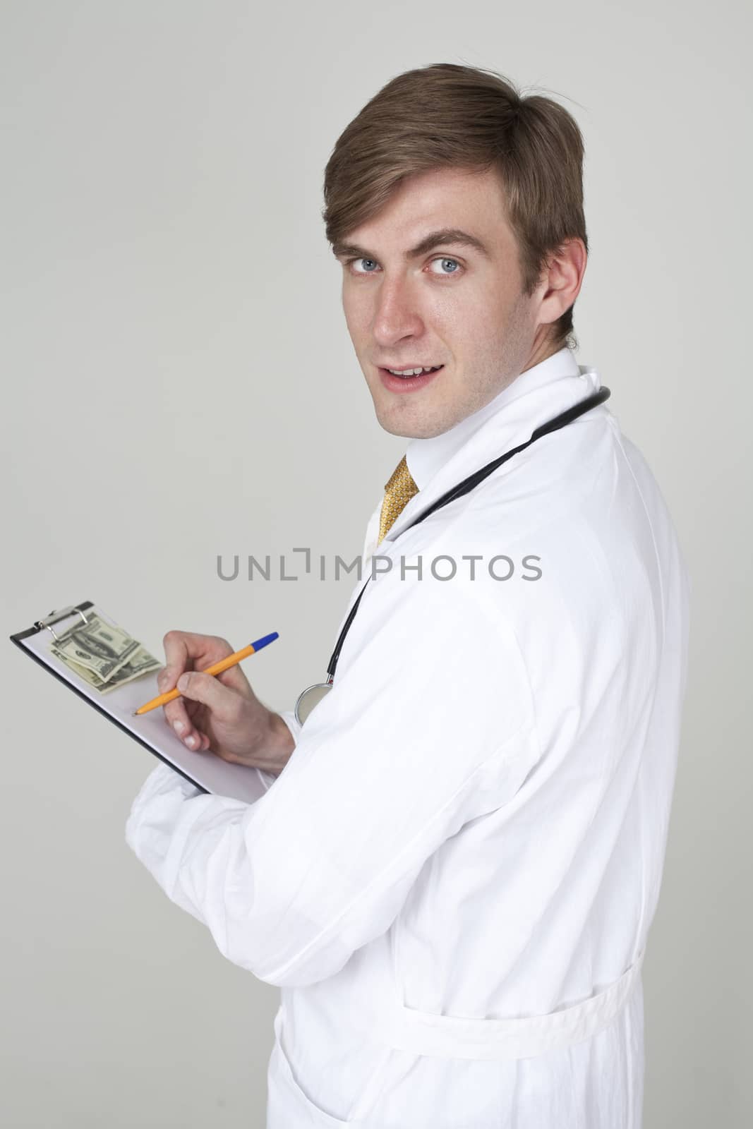 Studio portrait of a confident young doctor by andersonrise