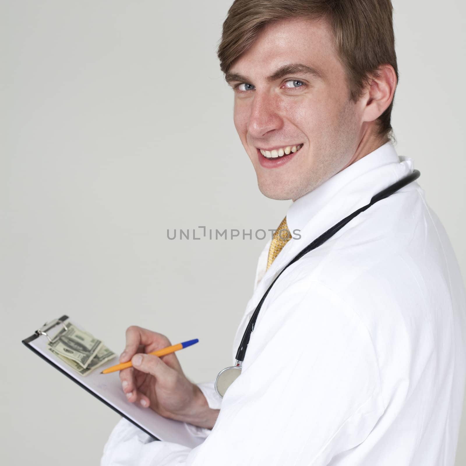 Studio portrait of a confident young doctor by andersonrise