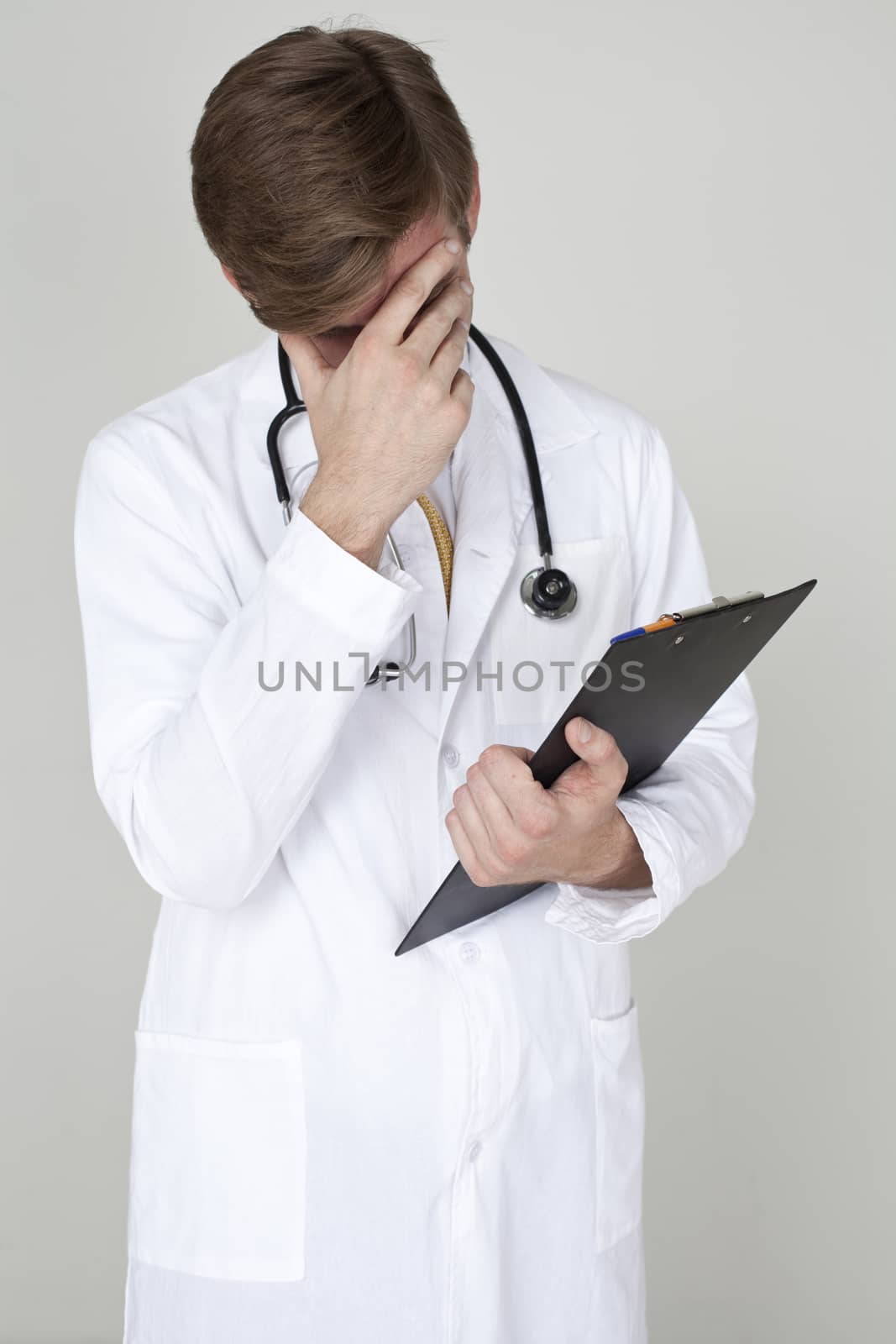 Studio portrait of a confident young doctor by andersonrise