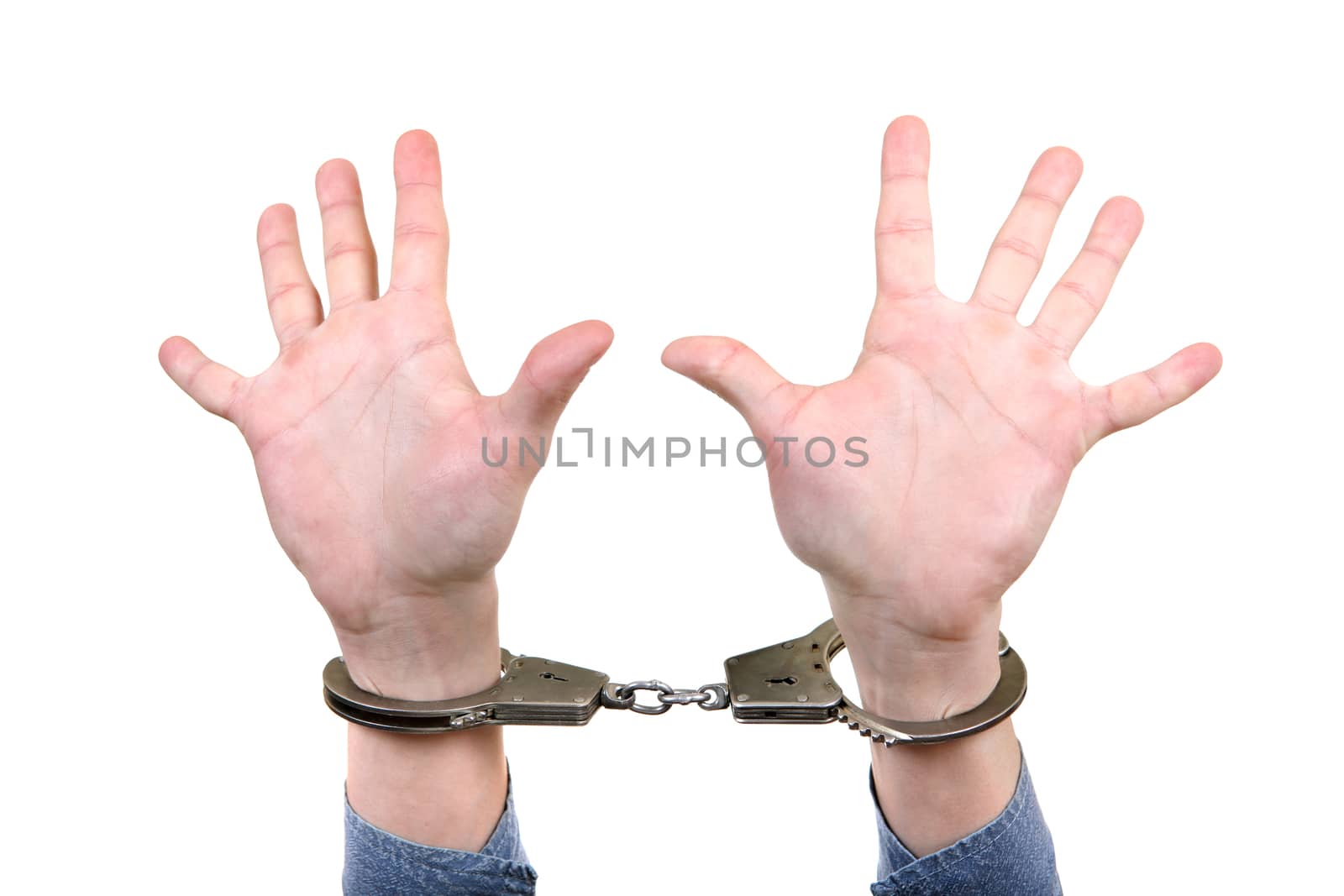 Handcuffs on Hands closeup by sabphoto