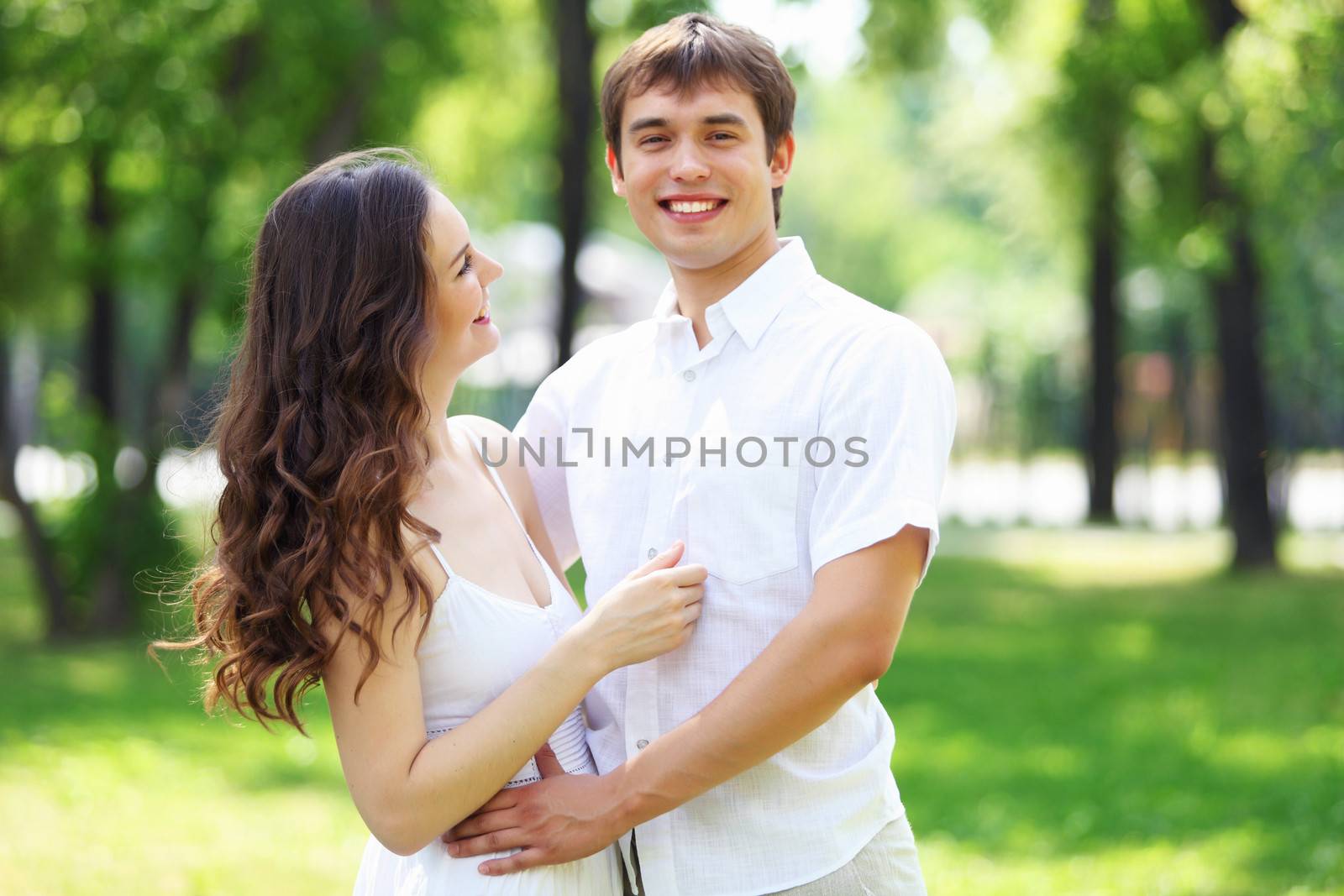 Young love Couple smiling under blue sky by sergey_nivens