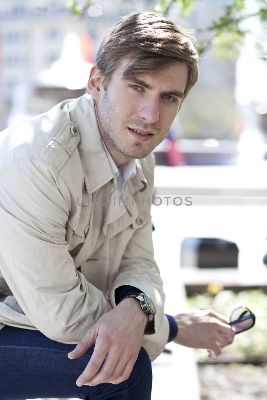 Portrait of young attractive man, outdoors