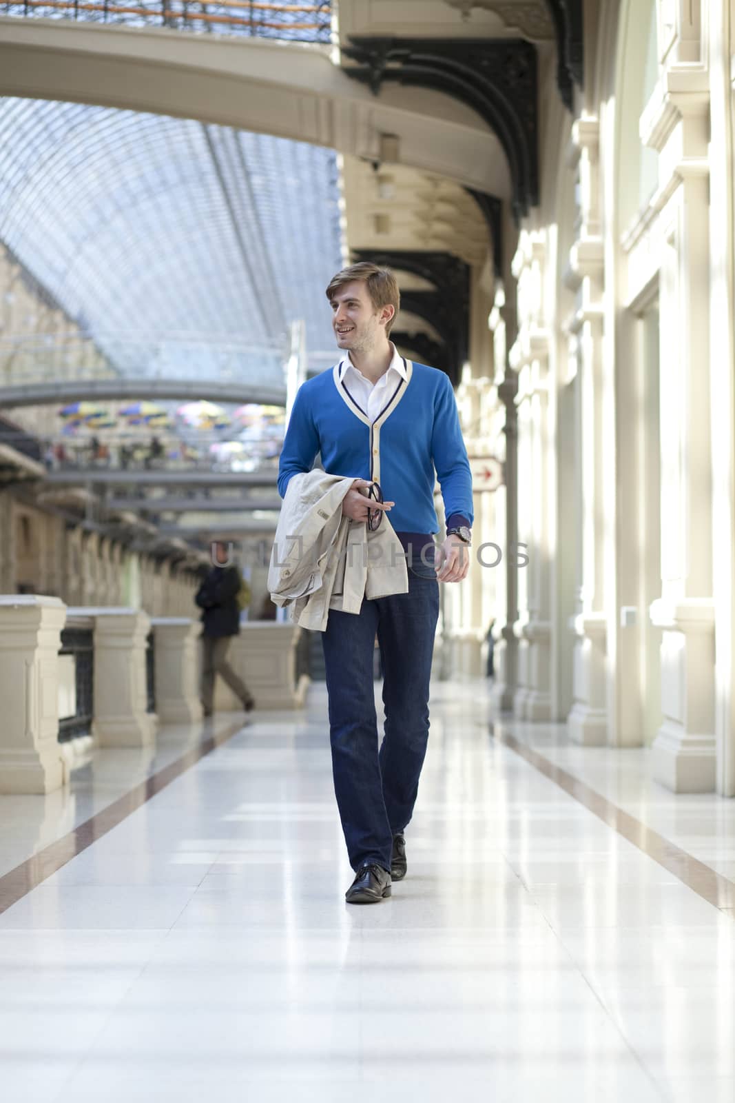 Young man walking in the store