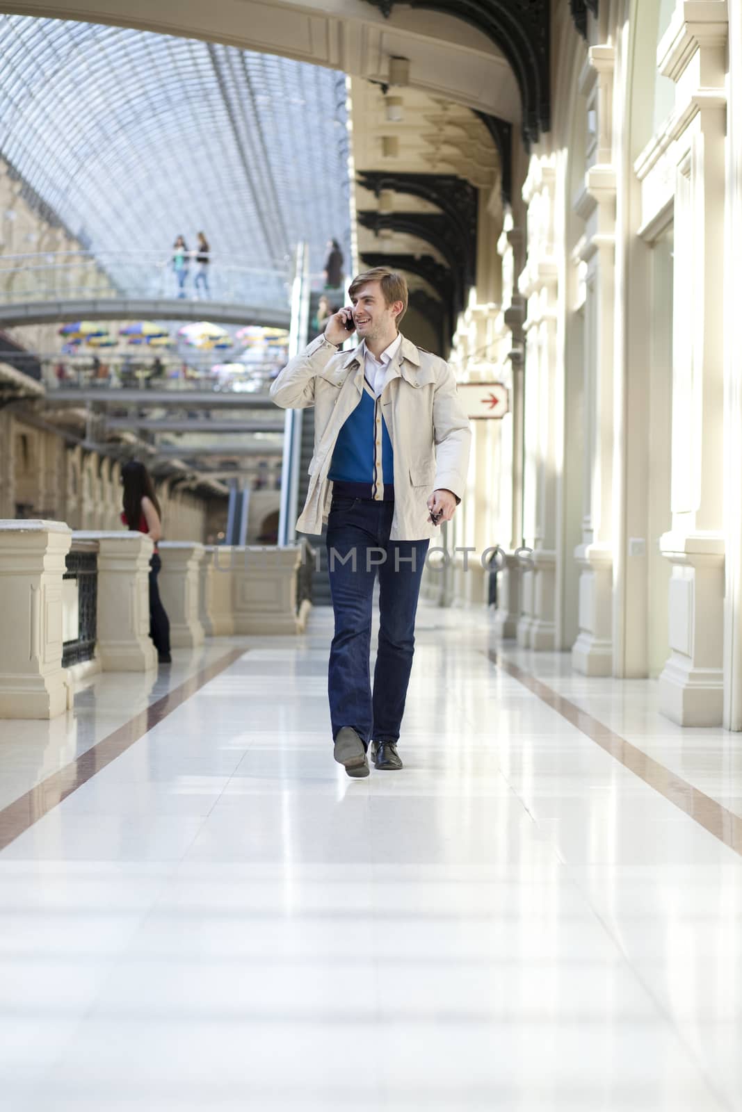 Young man walking in the store