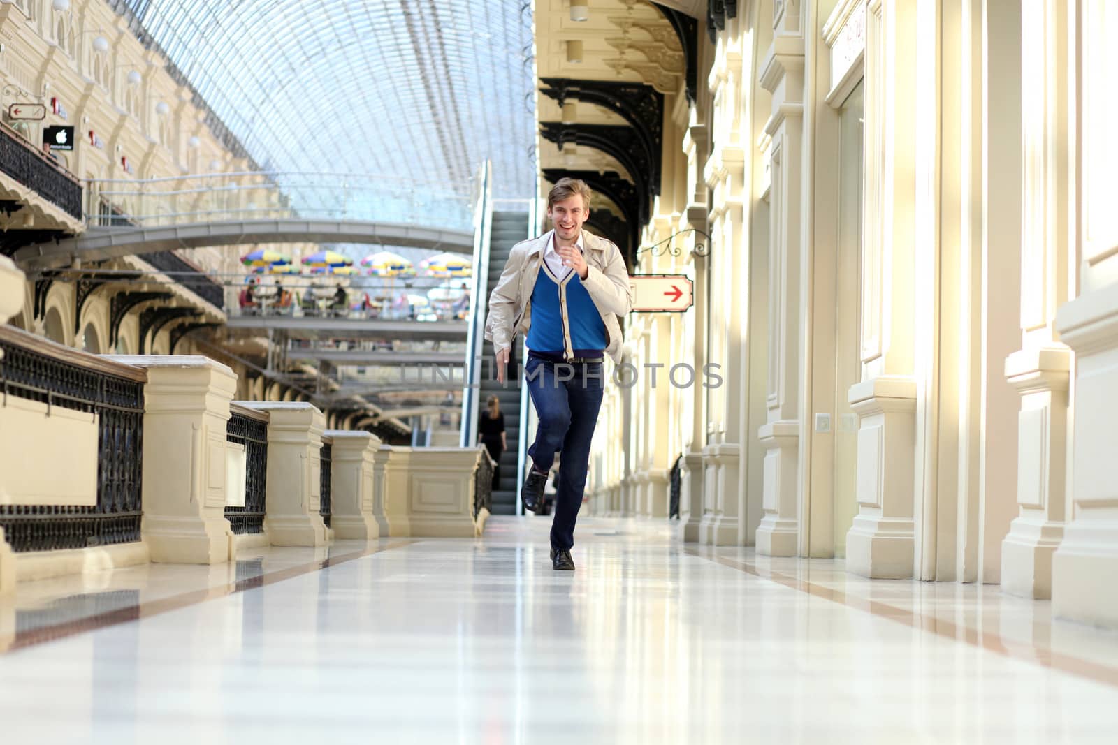 Young man running in the store
