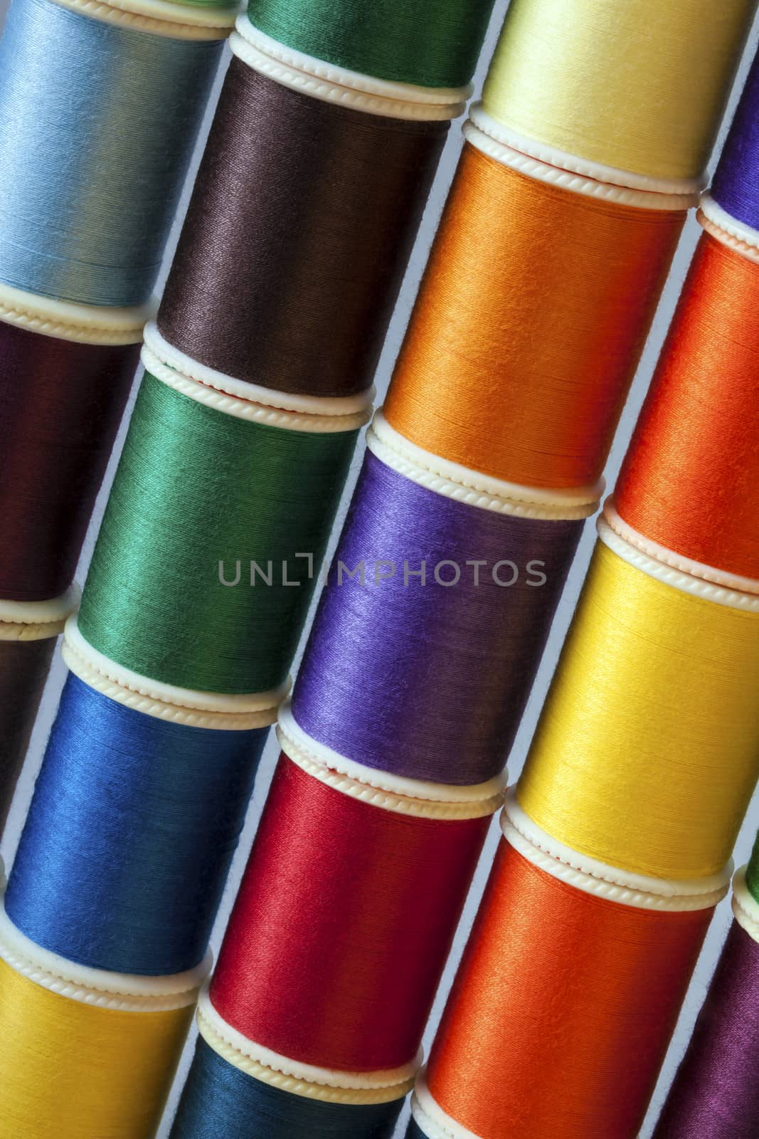 Range of colored sewing threads.