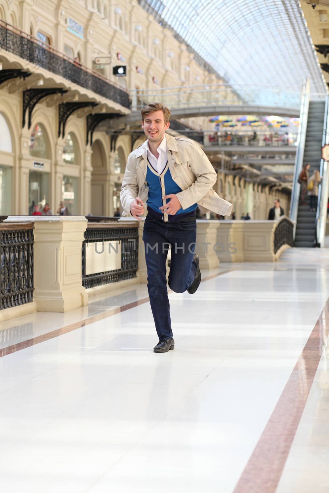 Young man running in the store