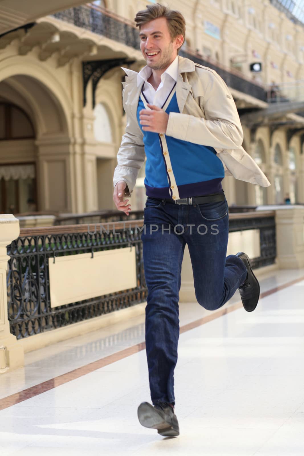 Young man running in the store