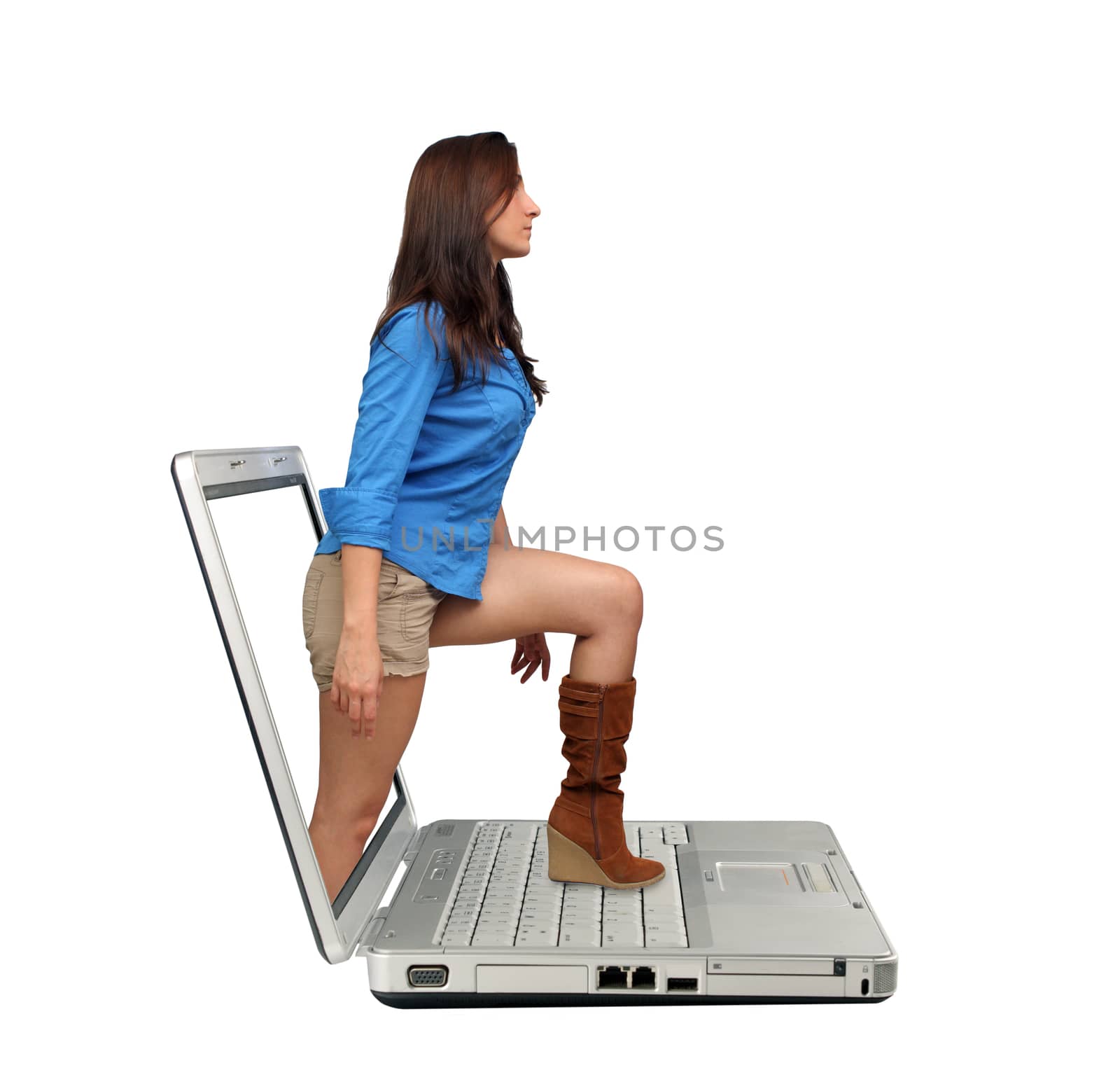 A lovely young brunette steps out of the screen onto the keyboard of a laptop computer.  Isolated on a white background with generous copyspace.