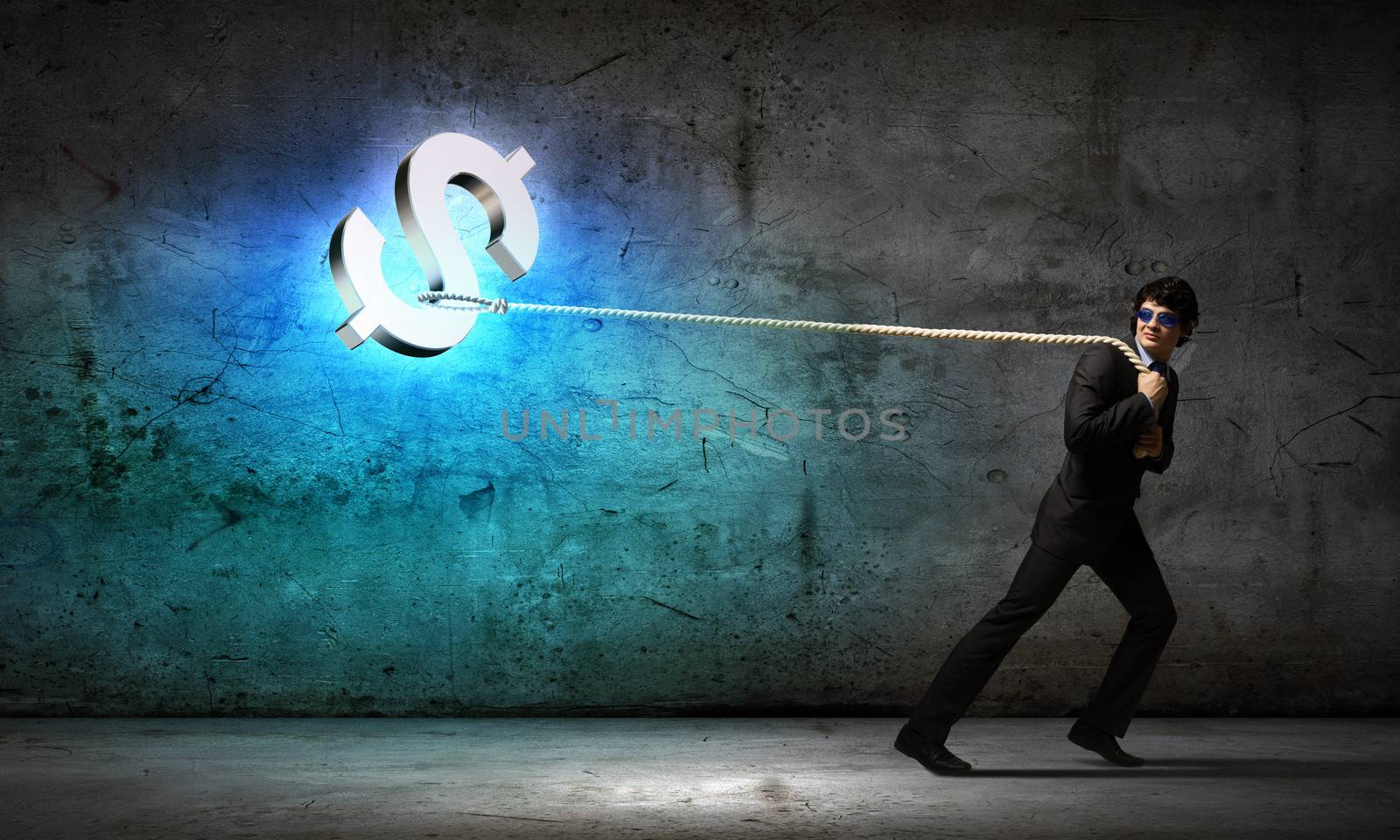 Young man pulling dollar symbol with rope