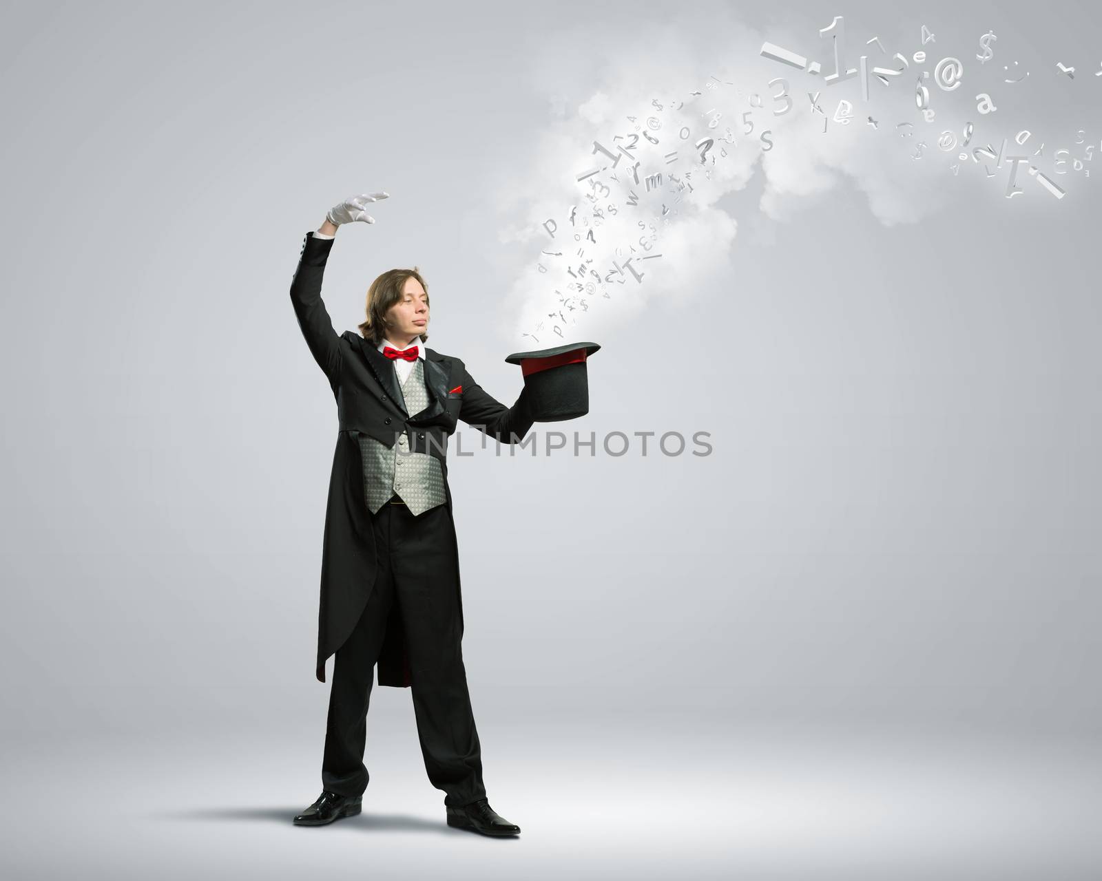 Image of magician holding hat with lights and fumes going out