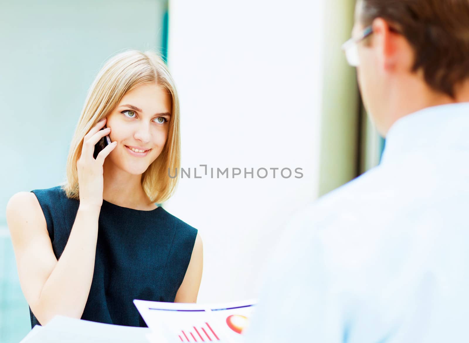 Two young business collegue working together in office