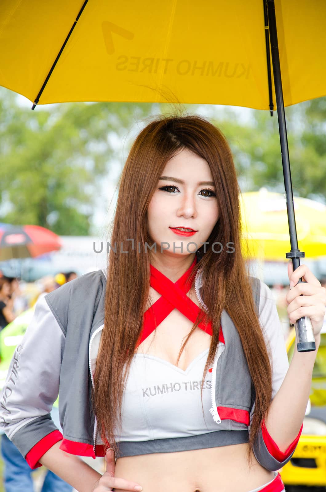 CHOUN BURI - AUGUST 18: Unidentified model with racing car on display at the Thailand Super Series 2013 Race 4 on August 18, 2013 at the Bira International Circuit Pattaya, Thailand.