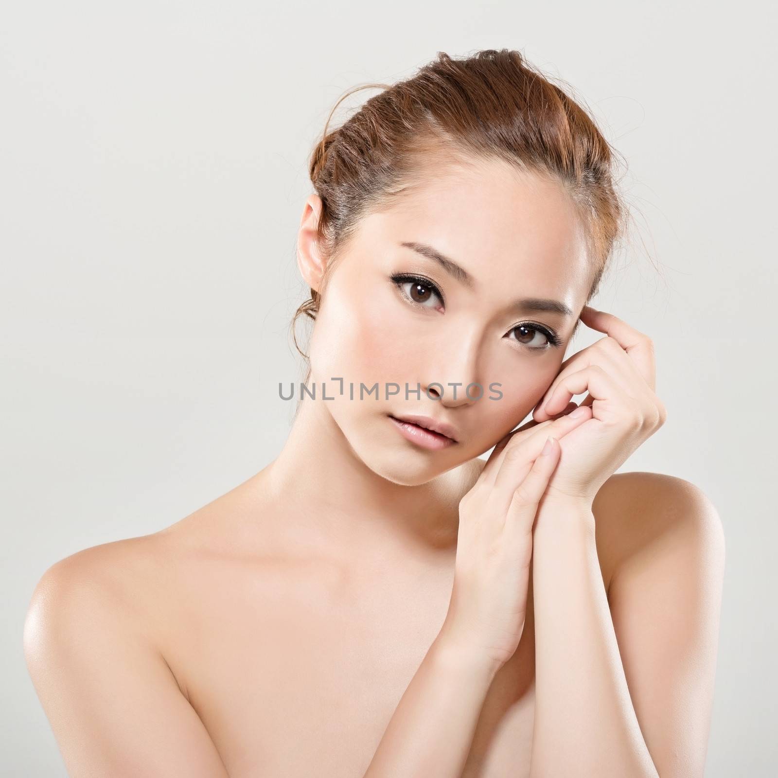 Asian beauty face closeup portrait with clean and fresh elegant lady. Studio shot.