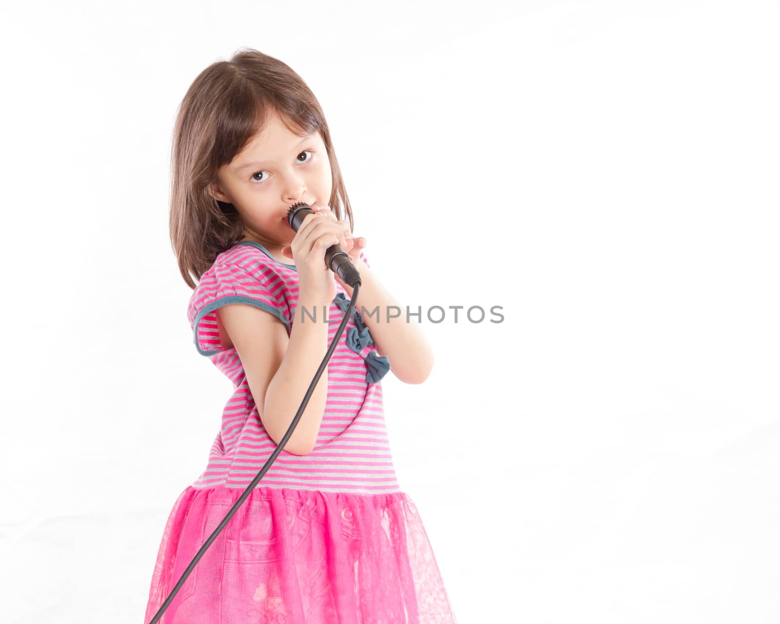 Asian female child singing with a microphone