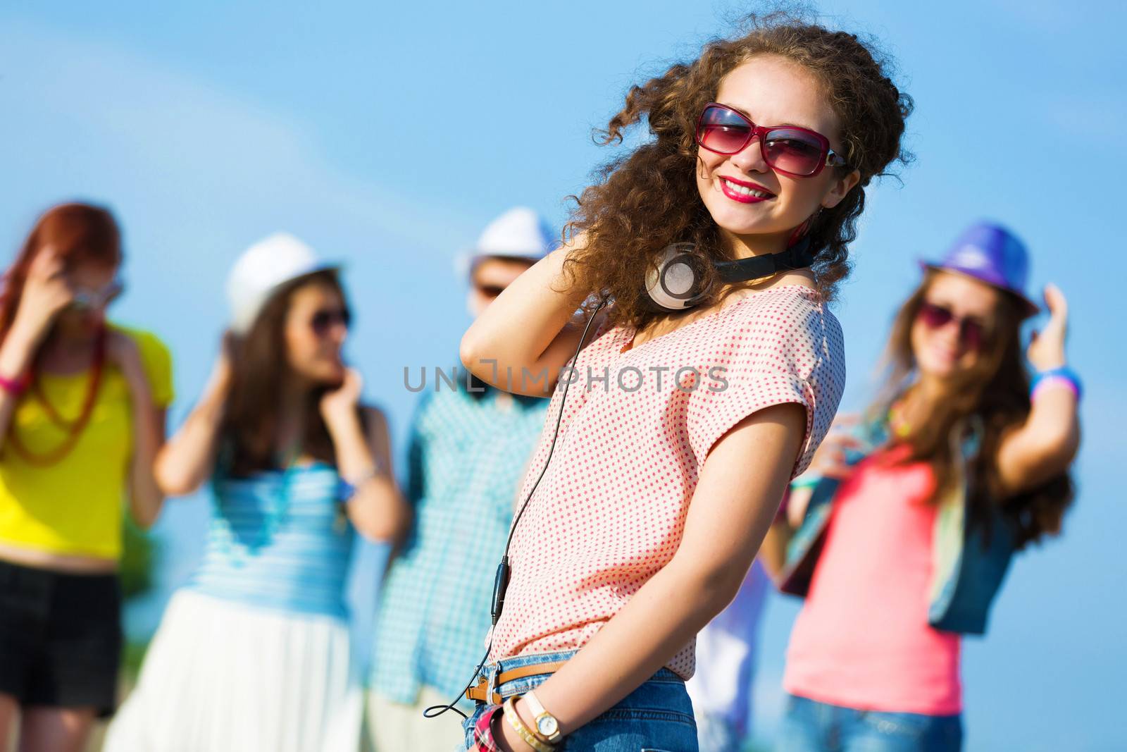 Image of young attractive woman with friends at background