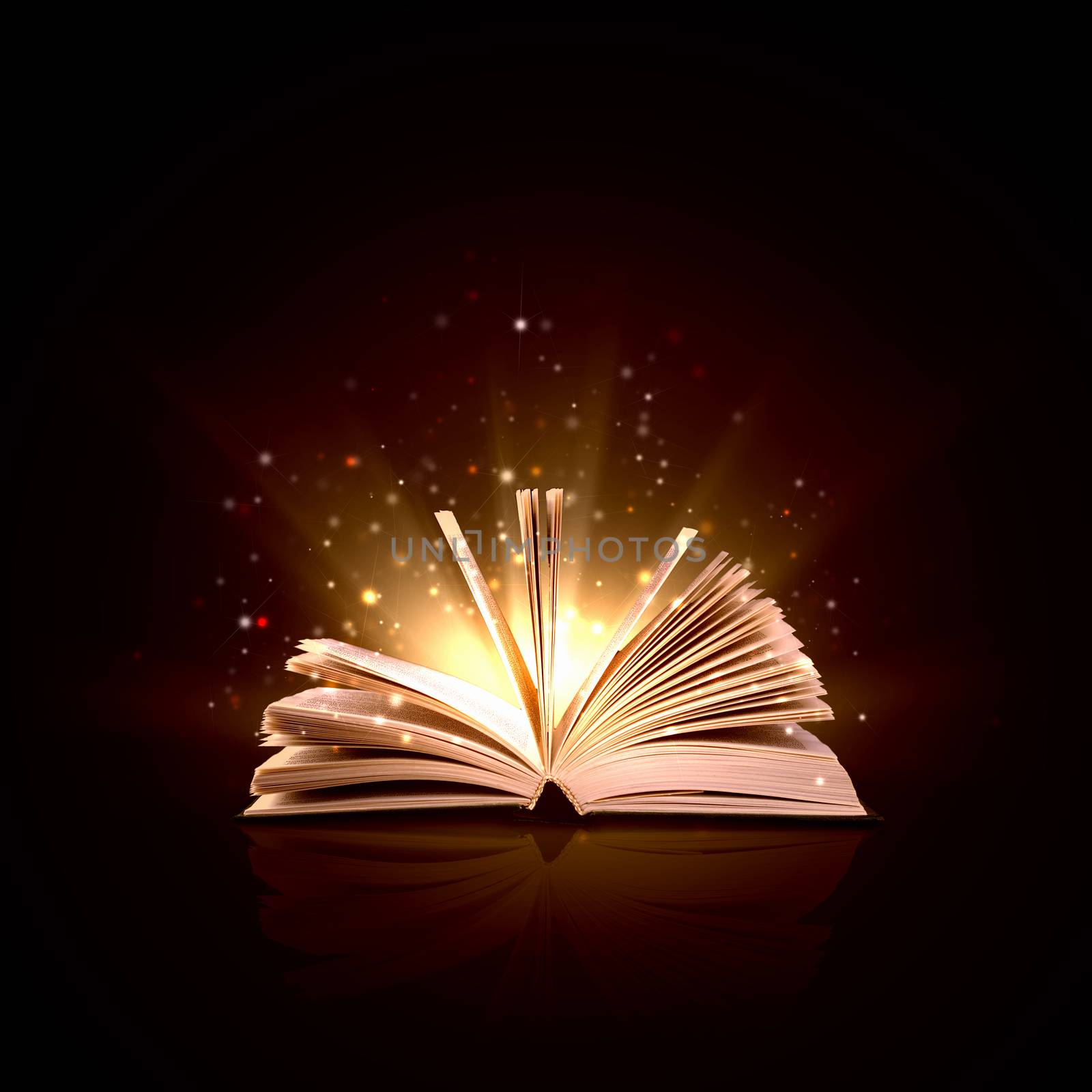 Image of opened magic book with magic lights
