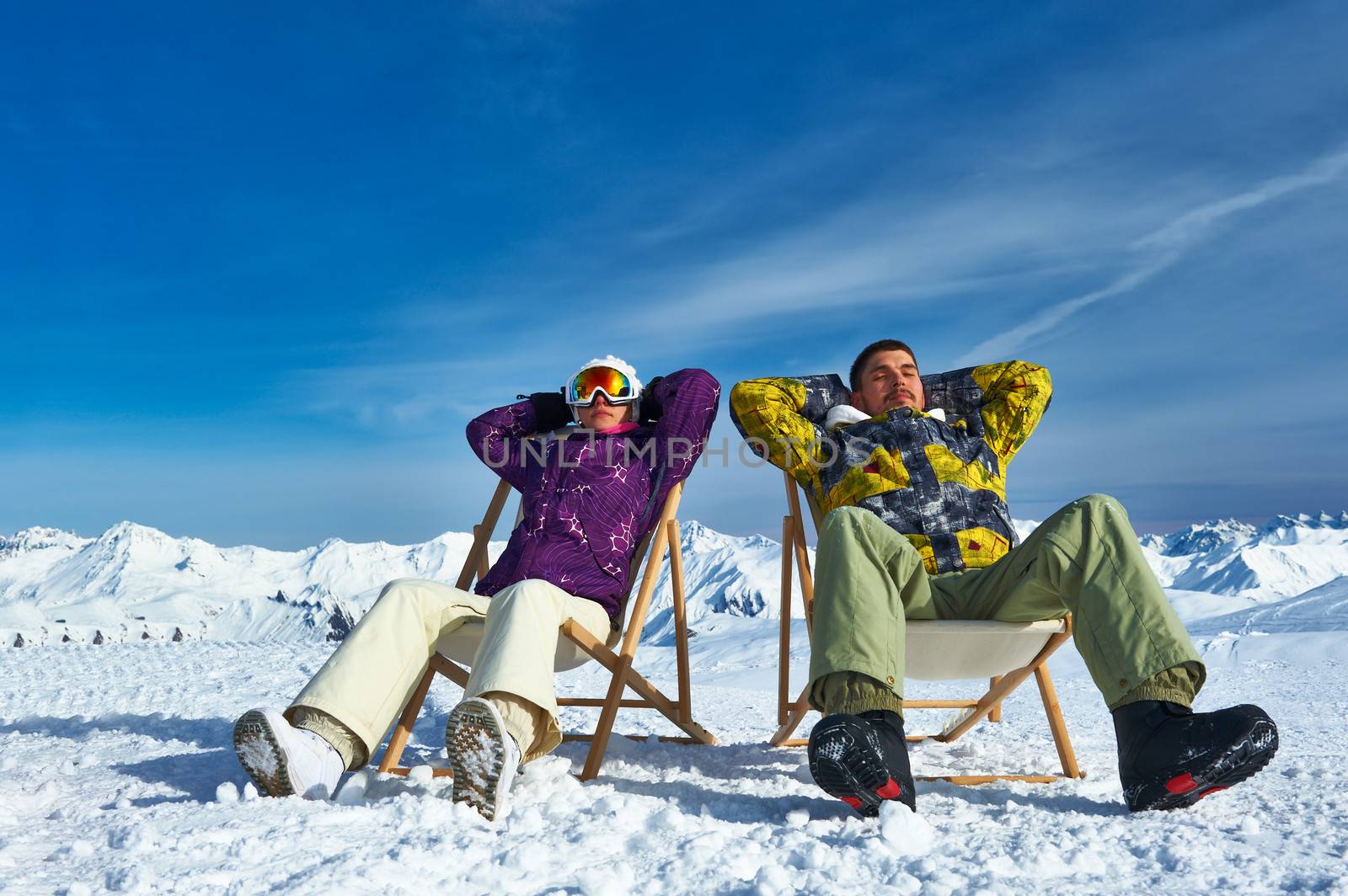 Couple at mountains in winter, Meribel, Alps, France