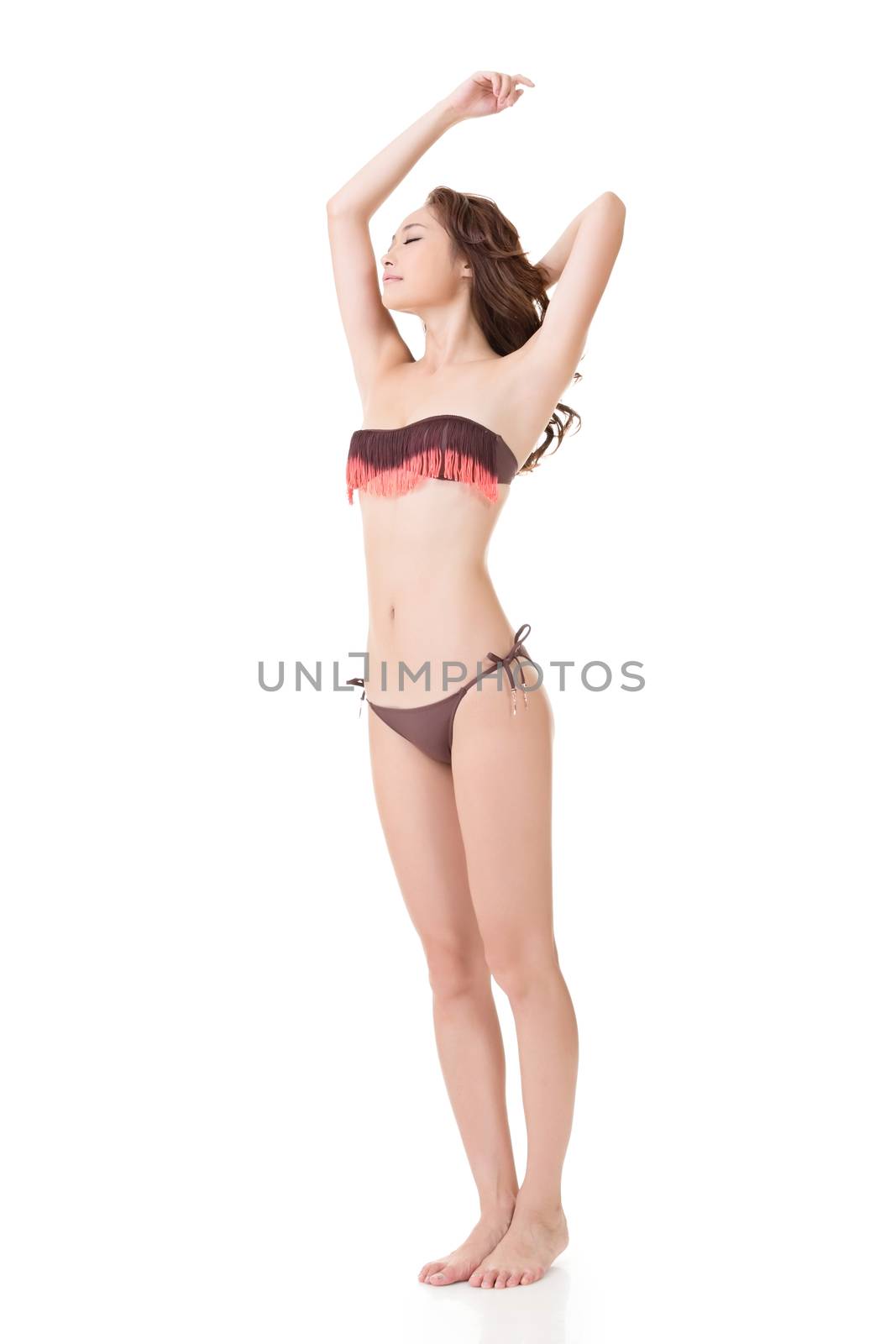 Summer bikini sexy asian young woman feel free and relaxing. Full length portrait. Isolated on the white background.