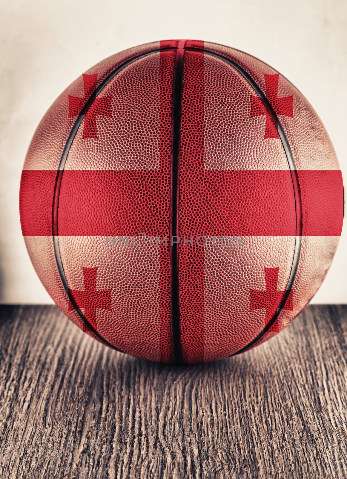 Close up of an old leather basketball with Georgia flag