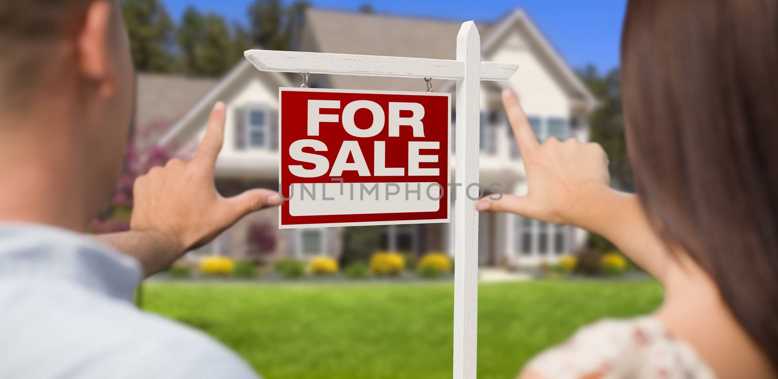 For Sale Real Estate Sign, House and Military Couple Framing Hands in Front.