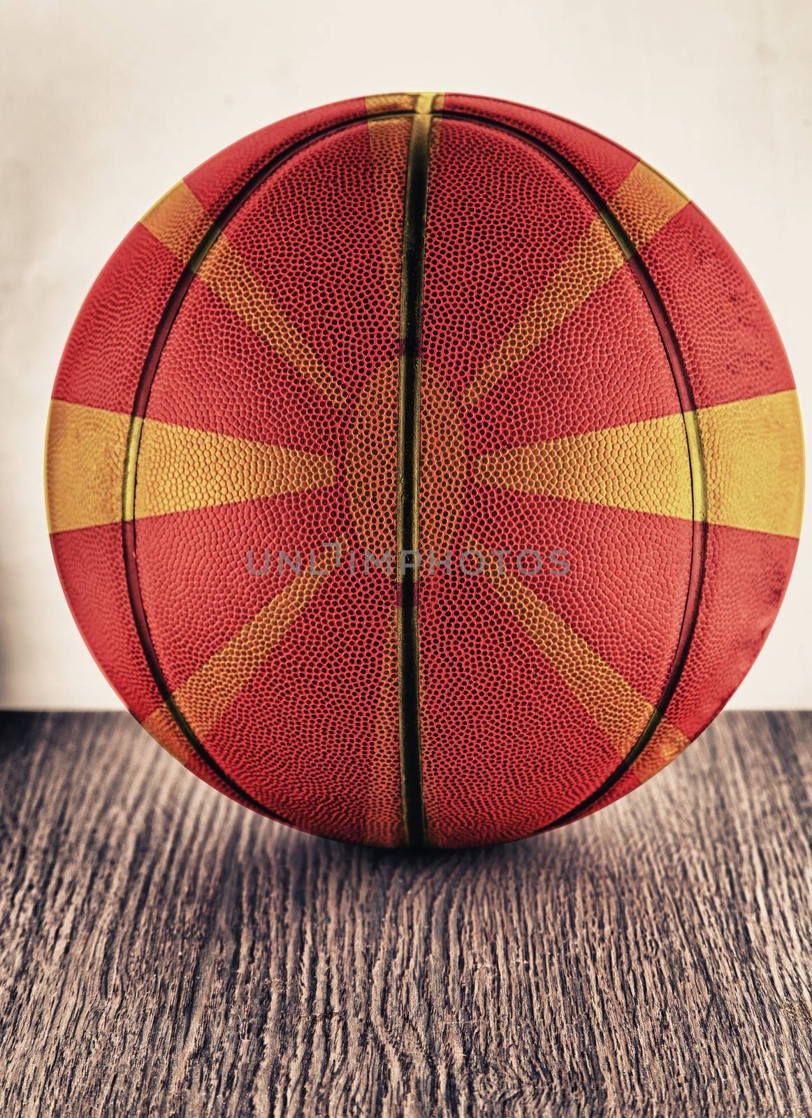 Close up of an old leather basketball with Macedonian flag