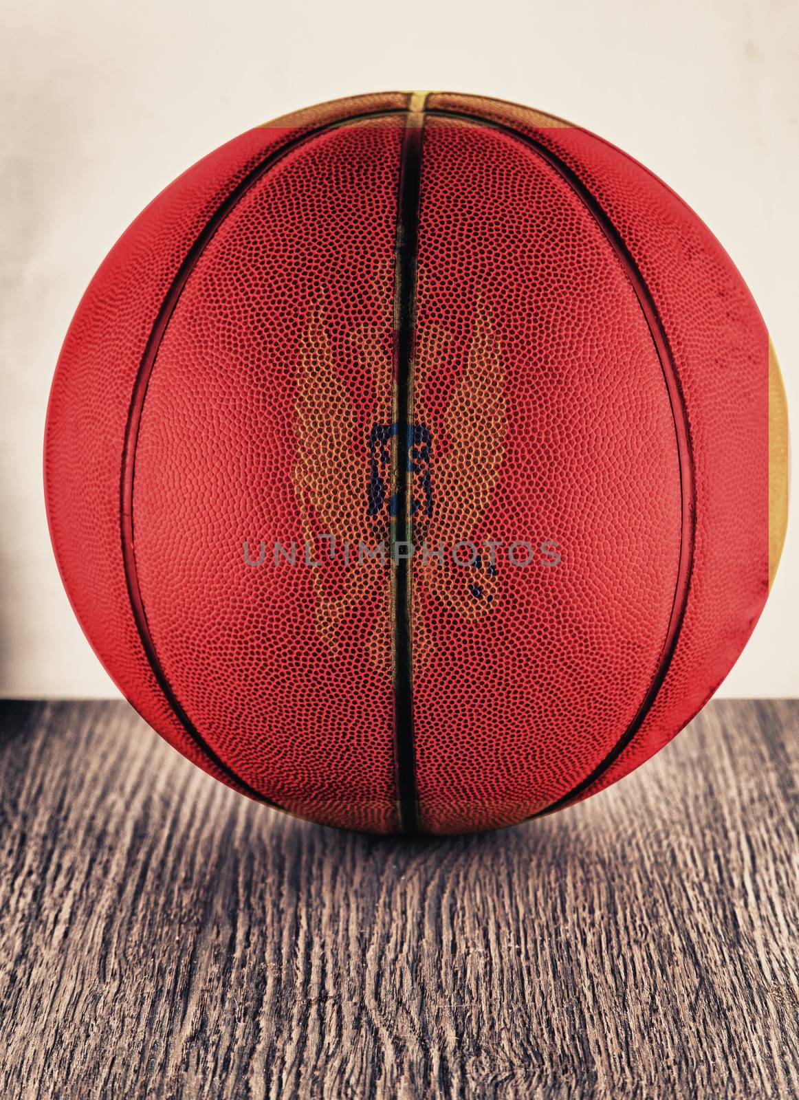 Close up of an old leather basketball with Montenegro flag