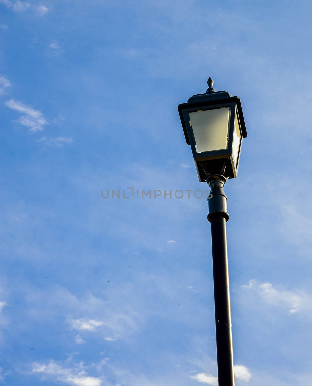 Light pole with blue sky by gjeerawut