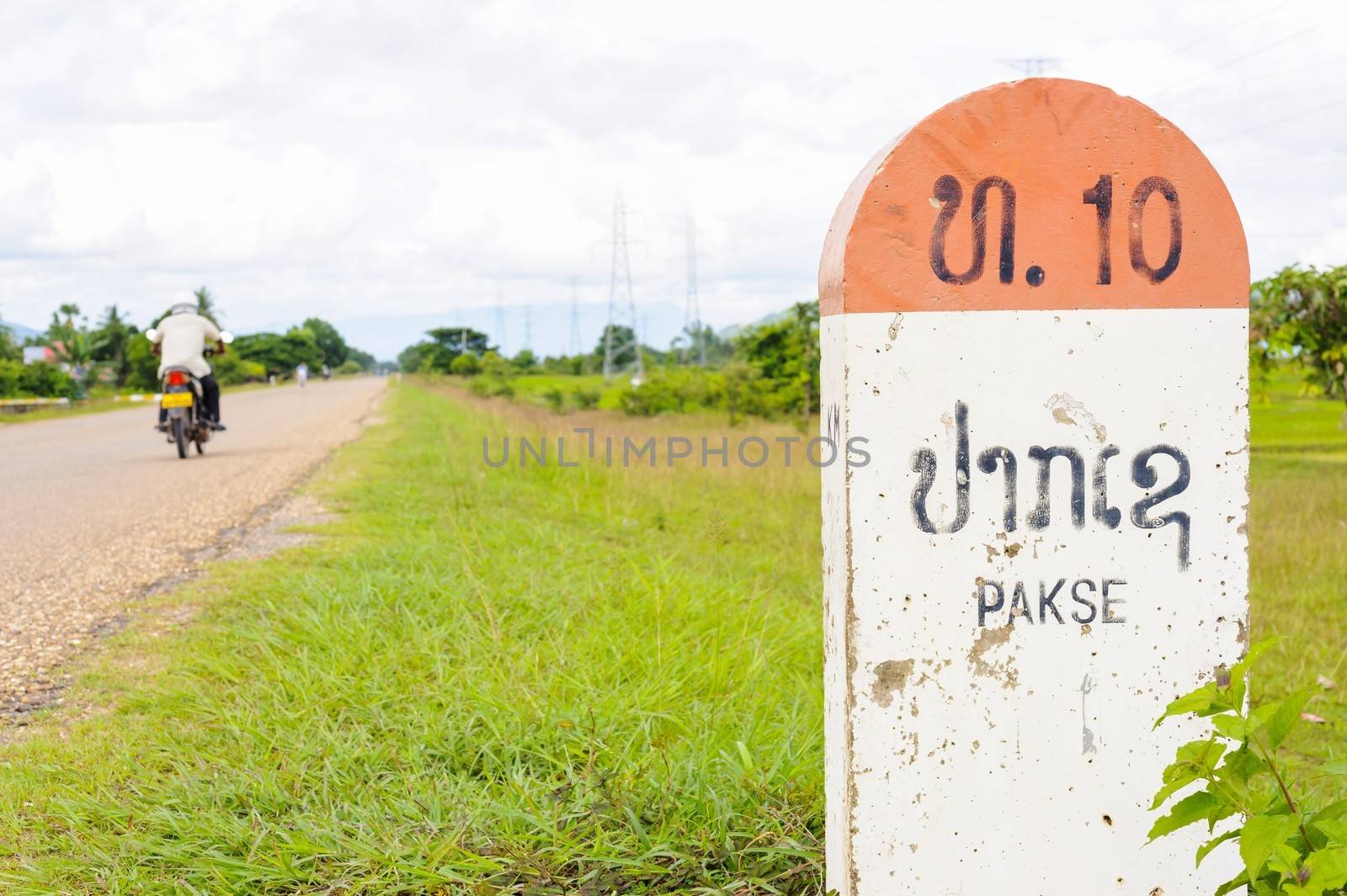 10 kilometer milestone on the National Highway 16E and direction sign to  Pakson to Pakse, Laos.