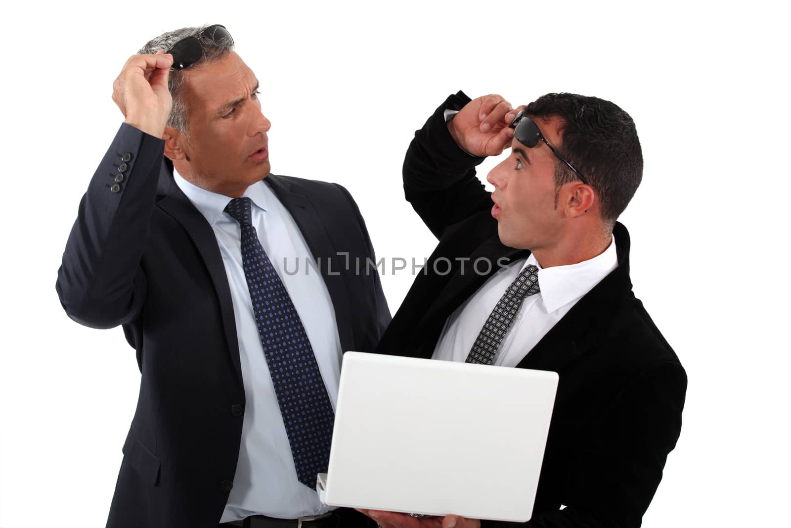Businessmen recognizing one another by phovoir